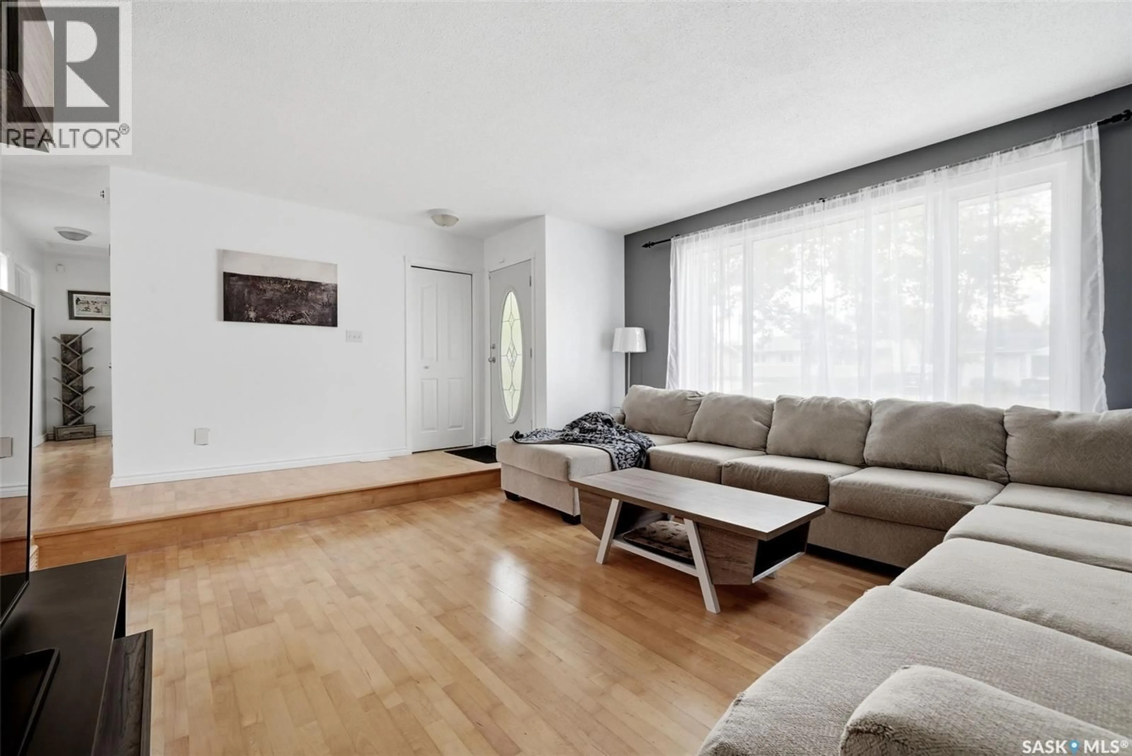 Living room with furniture, wood/laminate floor for 942 BROAD STREET, Regina Saskatchewan S4R5V7