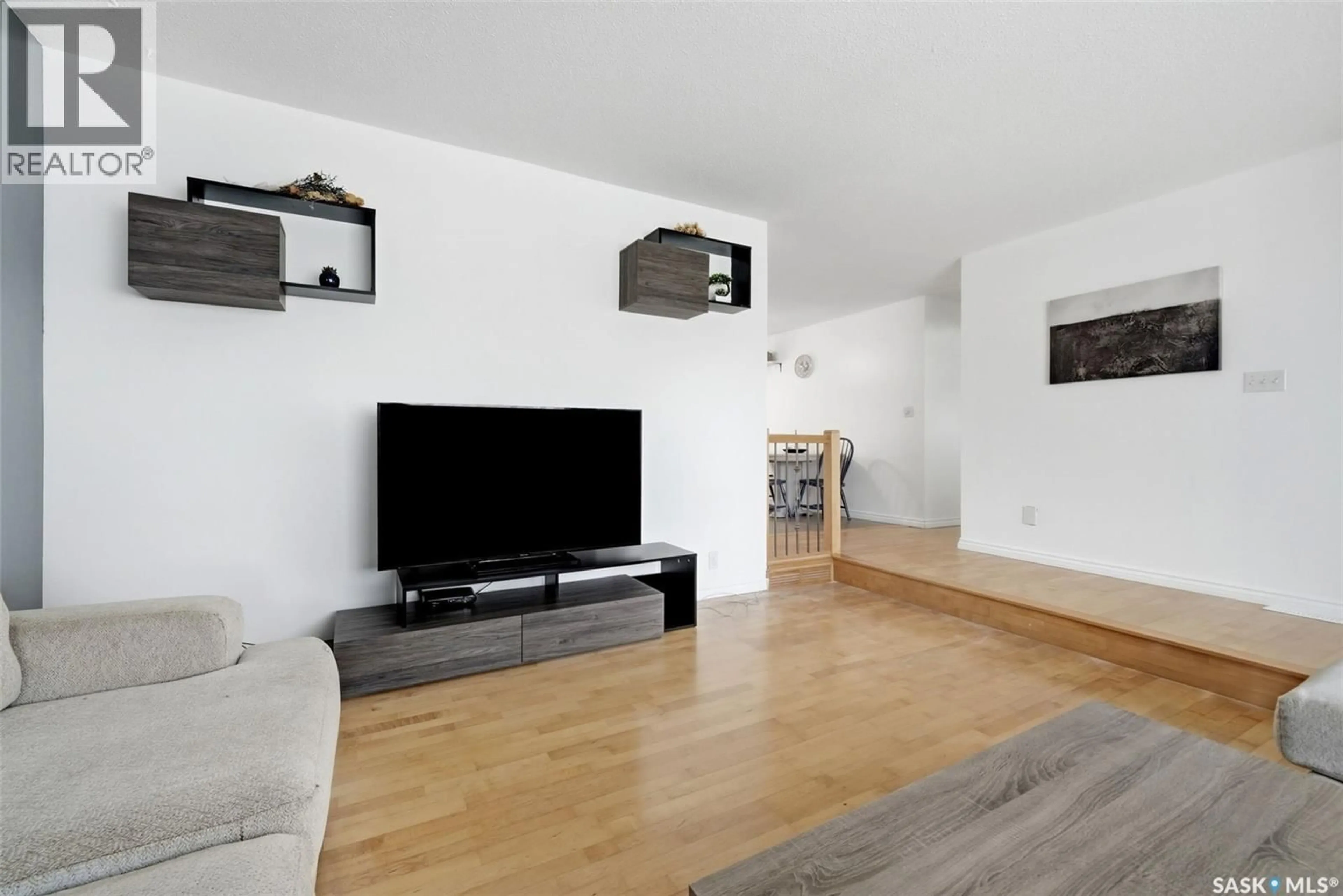 Living room with furniture, wood/laminate floor for 942 BROAD STREET, Regina Saskatchewan S4R5V7