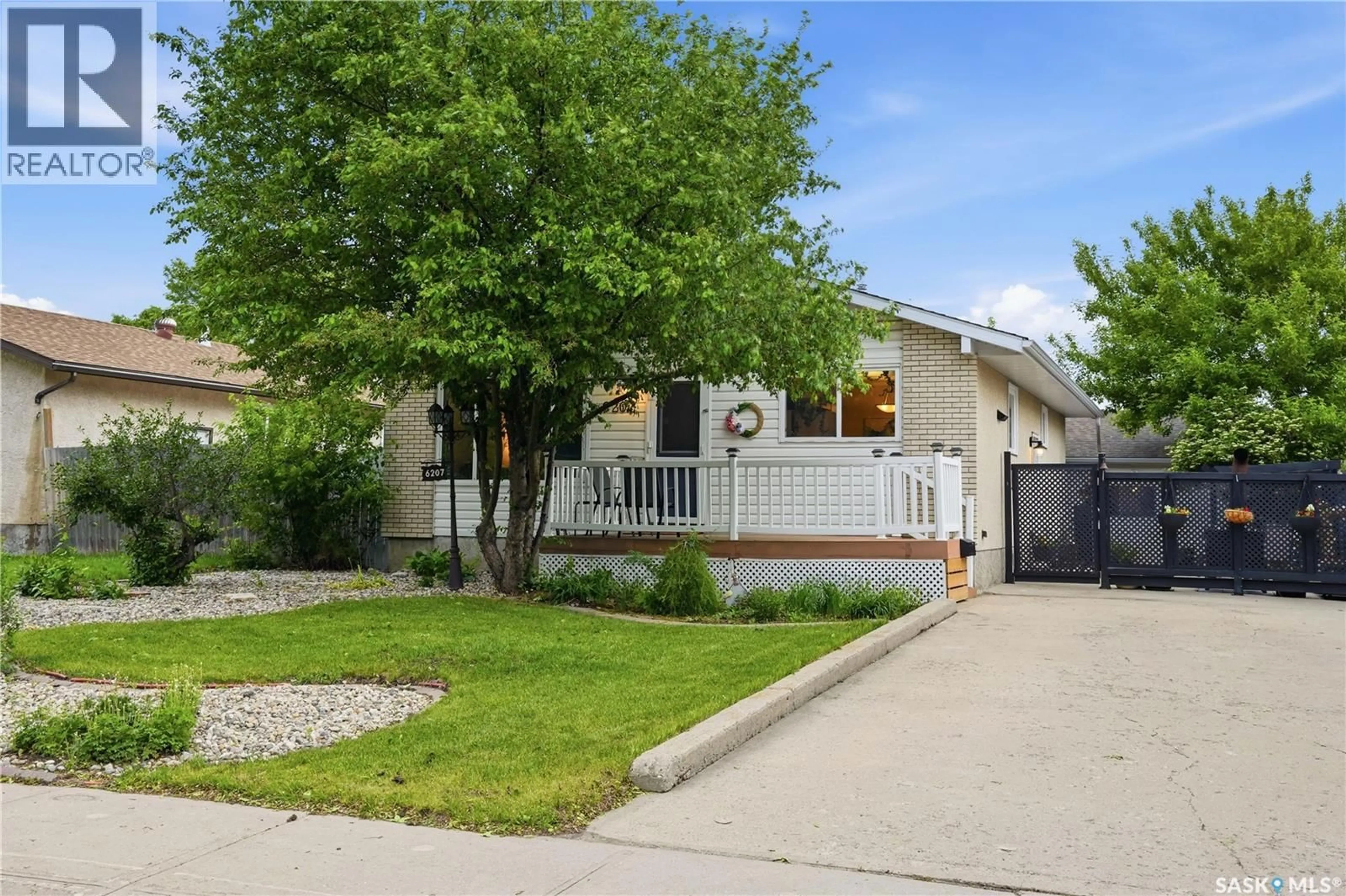 Home with vinyl exterior material, street for 6207 1ST AVENUE, Regina Saskatchewan S4T7A1