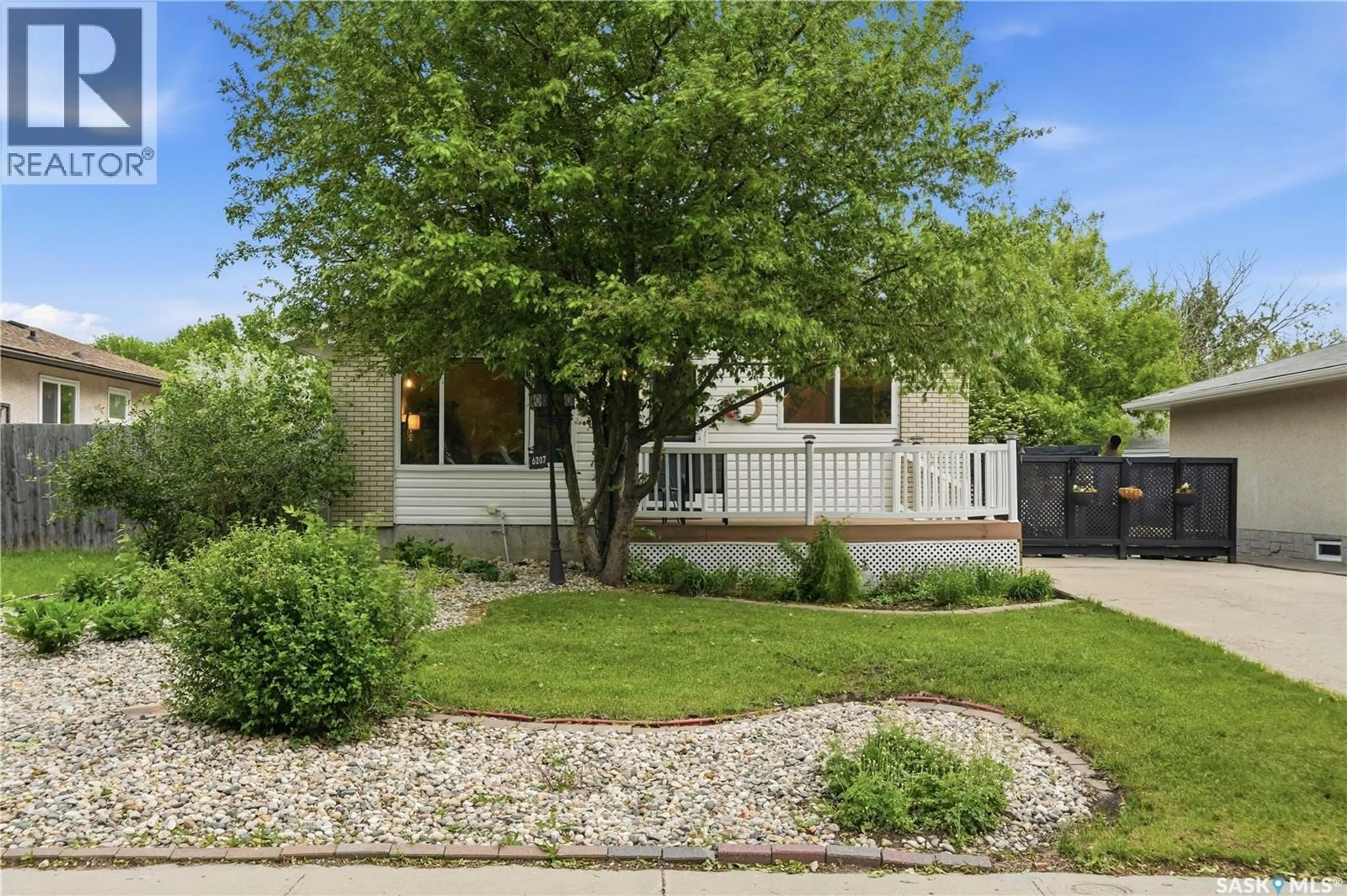 Home with vinyl exterior material, street for 6207 1ST AVENUE, Regina Saskatchewan S4T7A1