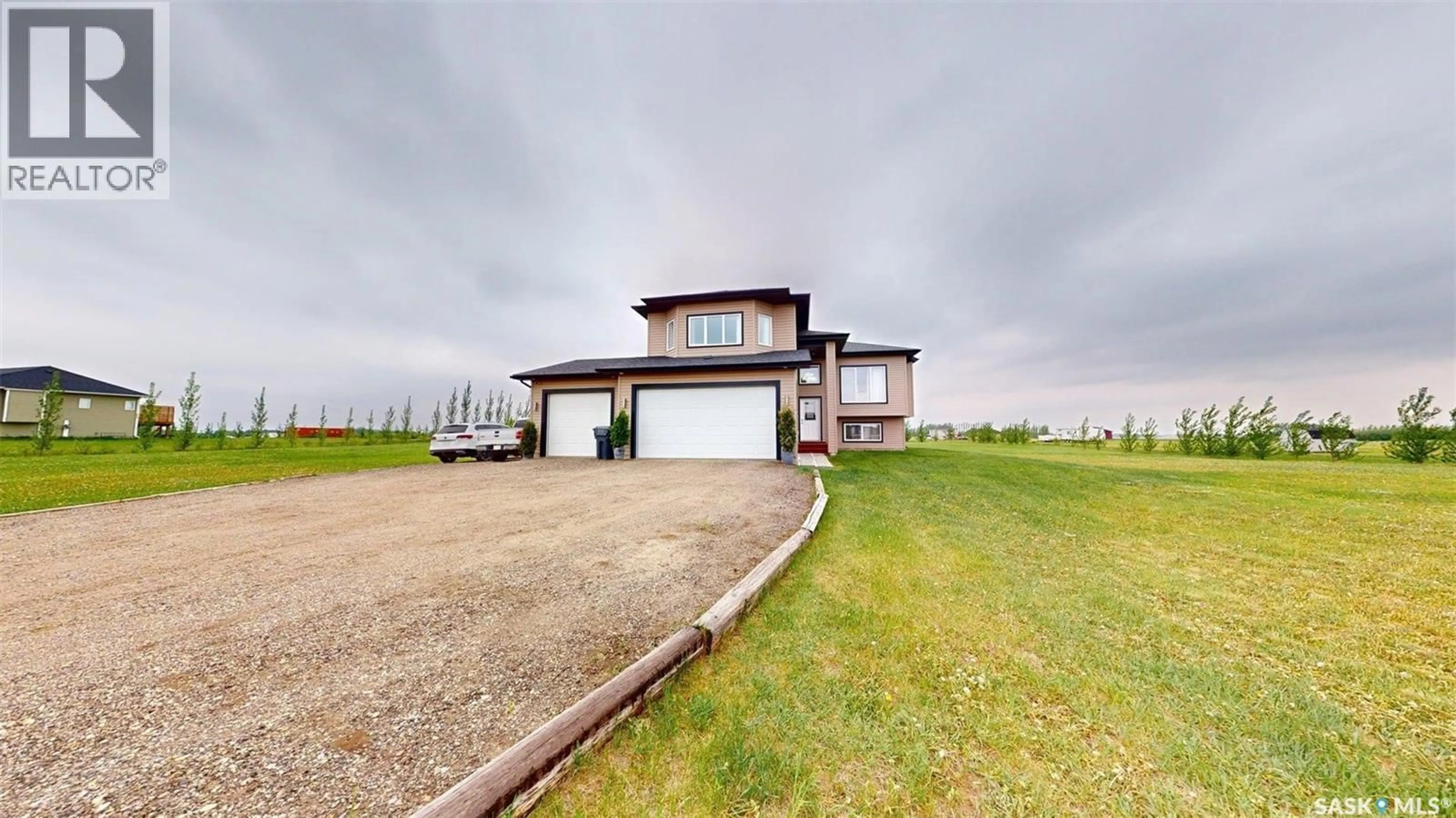 A pic from outside/outdoor area/front of a property/back of a property/a pic from drone, water/lake/river/ocean view for 100 RIDER PLACE, Dundurn Rm No. 314 Saskatchewan S7C0B6