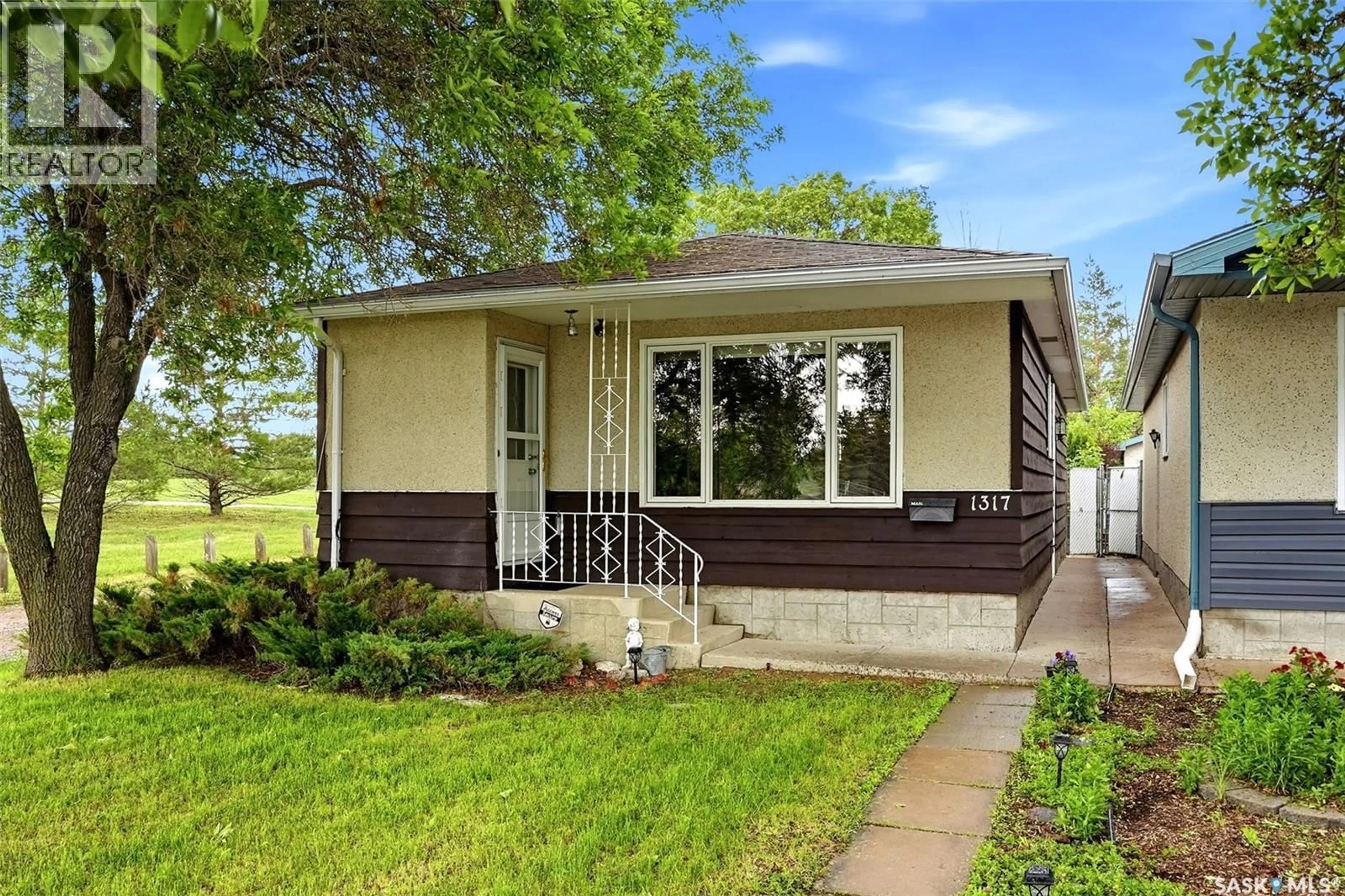Home with vinyl exterior material, street for 1317 KENT STREET, Regina Saskatchewan S4T5T2