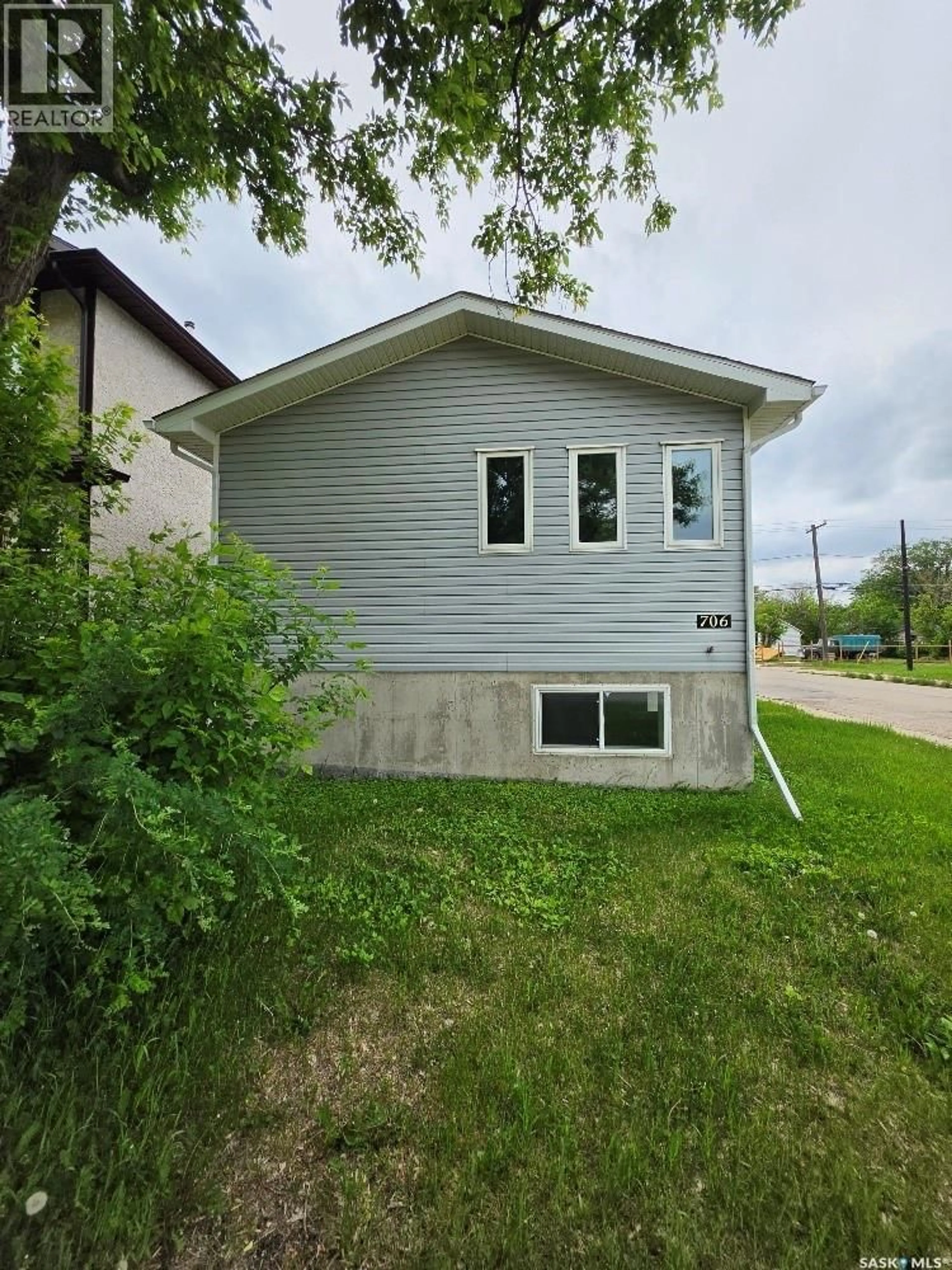 Home with vinyl exterior material, street for 706 RAE STREET, Regina Saskatchewan S4T2A9