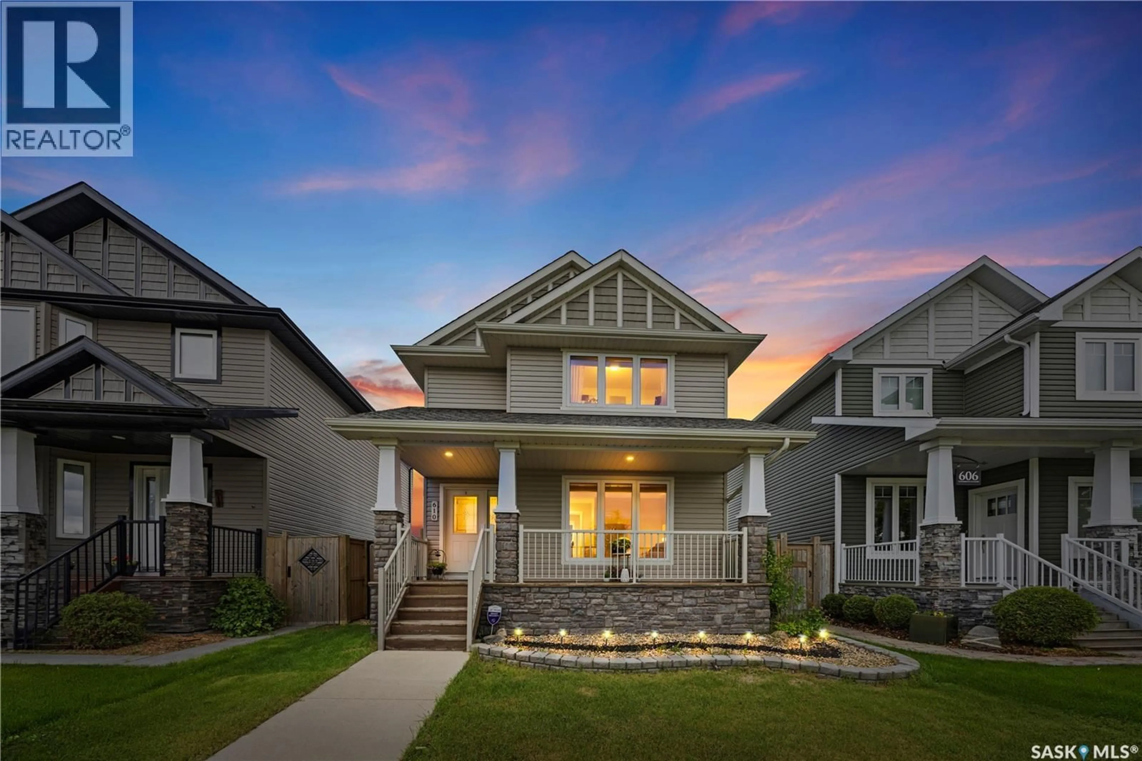 Home with vinyl exterior material, street for 610 STONEBRIDGE COMMON, Saskatoon Saskatchewan S7K0M9