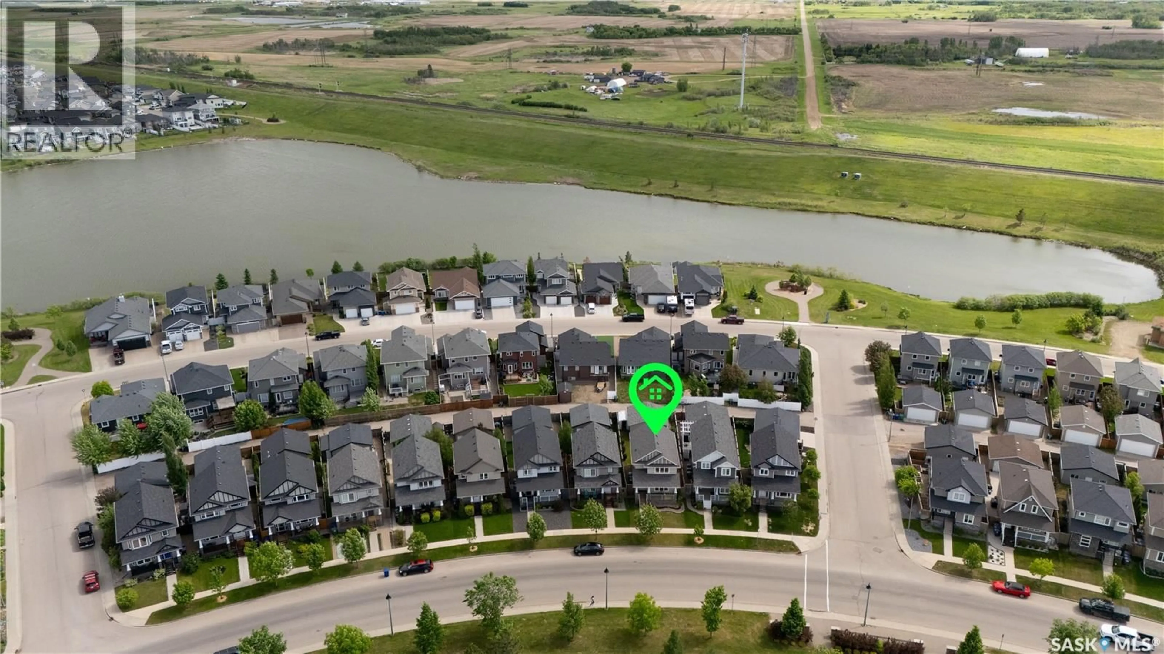 A pic from outside/outdoor area/front of a property/back of a property/a pic from drone, water/lake/river/ocean view for 610 STONEBRIDGE COMMON, Saskatoon Saskatchewan S7K0M9