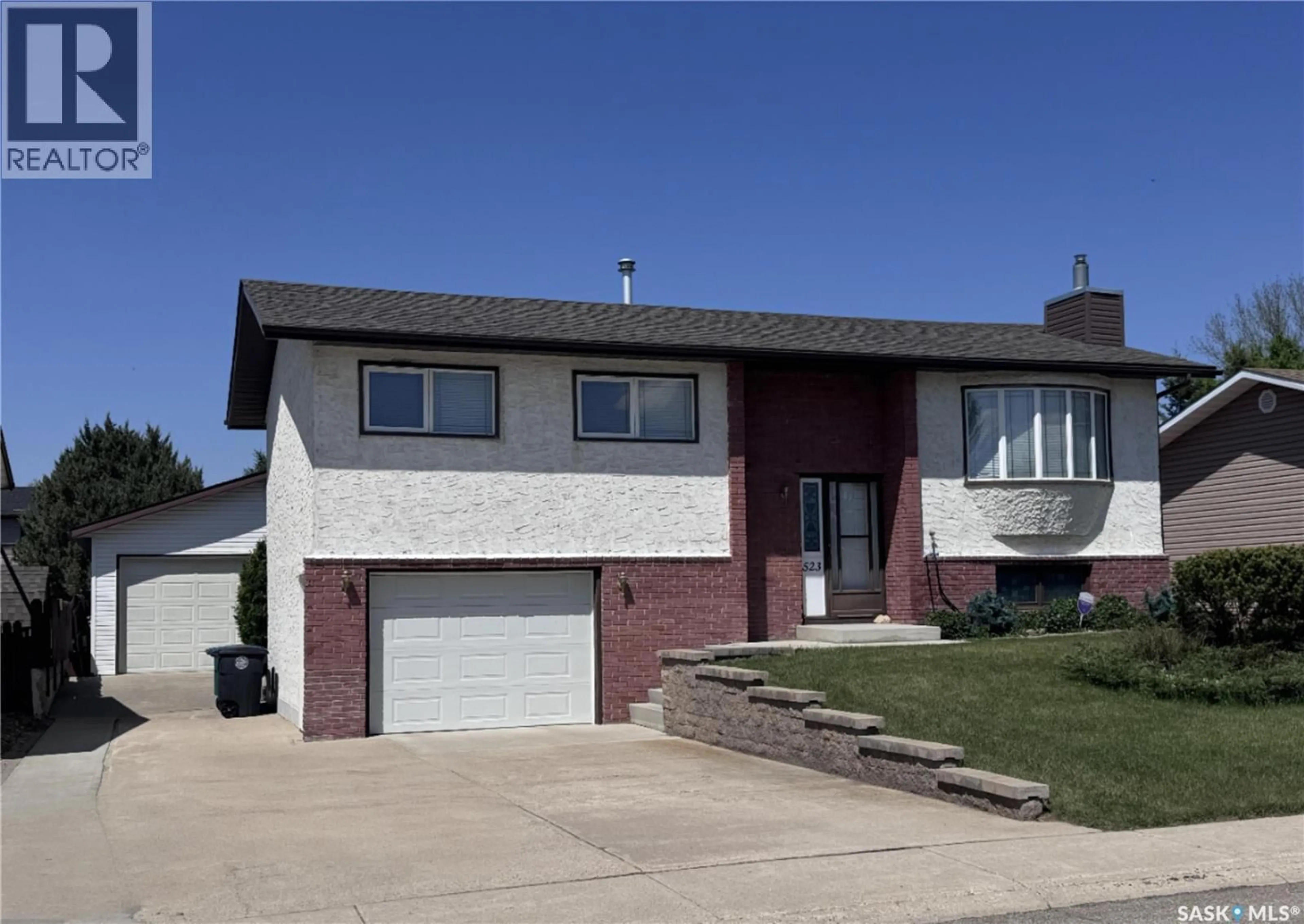 Home with vinyl exterior material, street for 523 8TH AVENUE, Biggar Saskatchewan S0K0M0