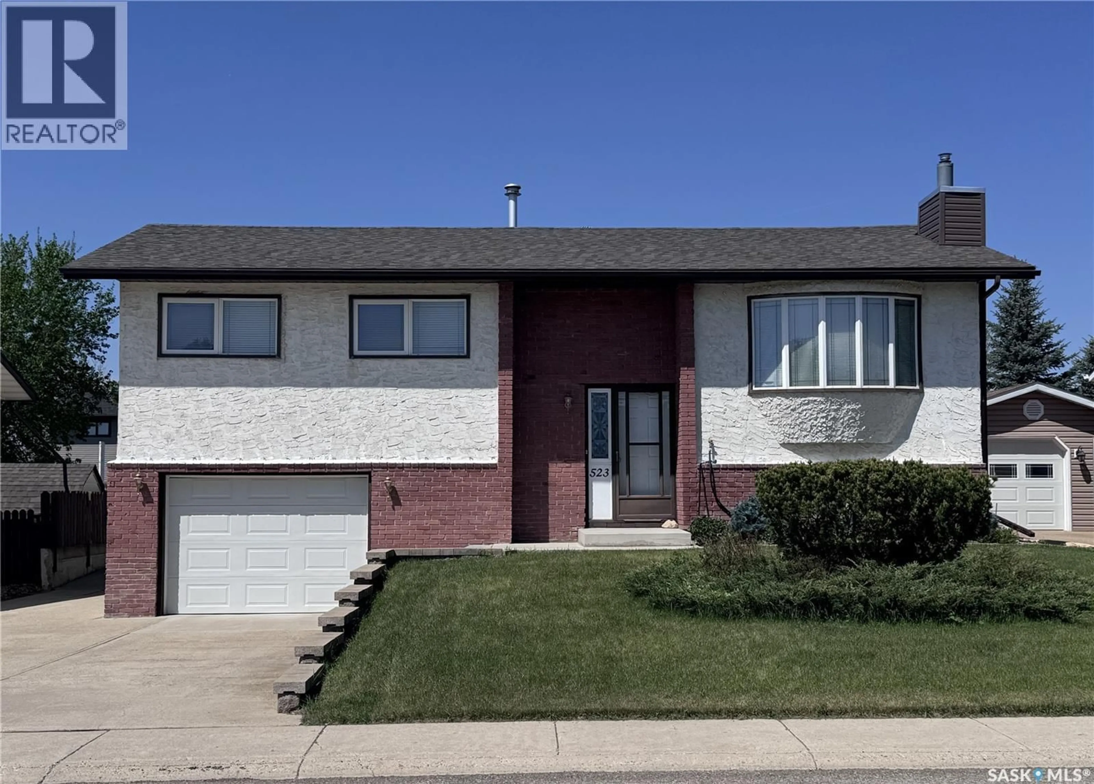 Home with brick exterior material, street for 523 8TH AVENUE, Biggar Saskatchewan S0K0M0