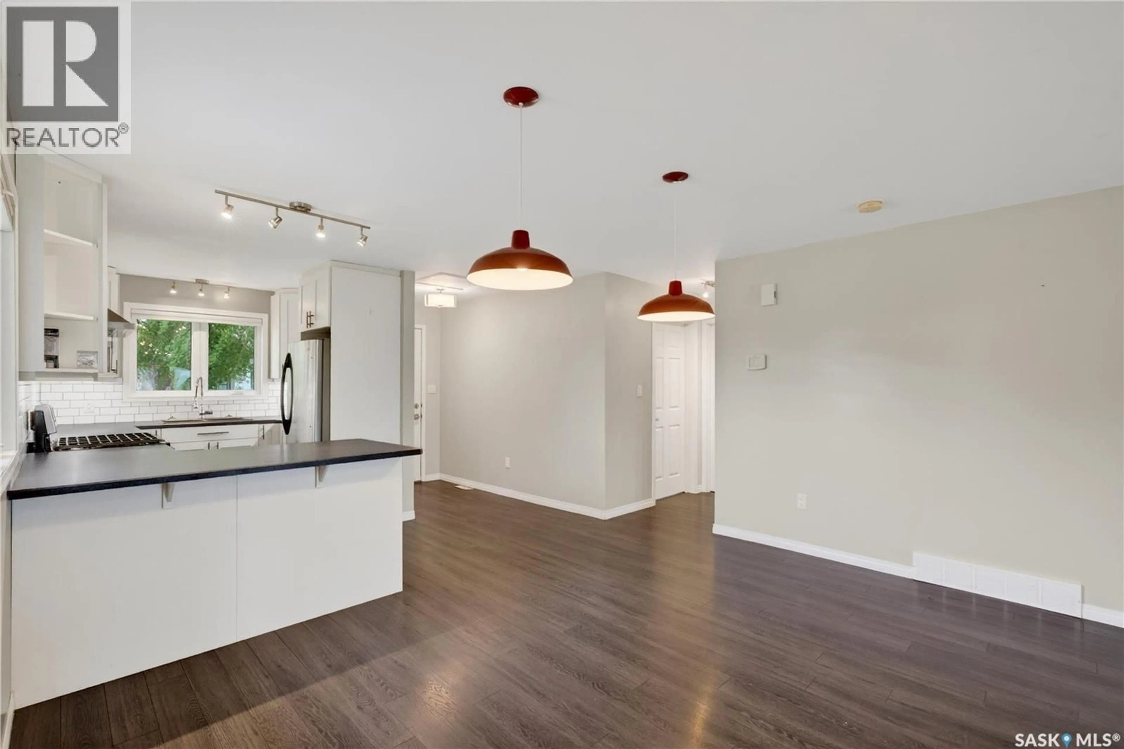 Open concept kitchen, wood/laminate floor for 520 CARIBOU CRESCENT, Tisdale Saskatchewan S0E1T0