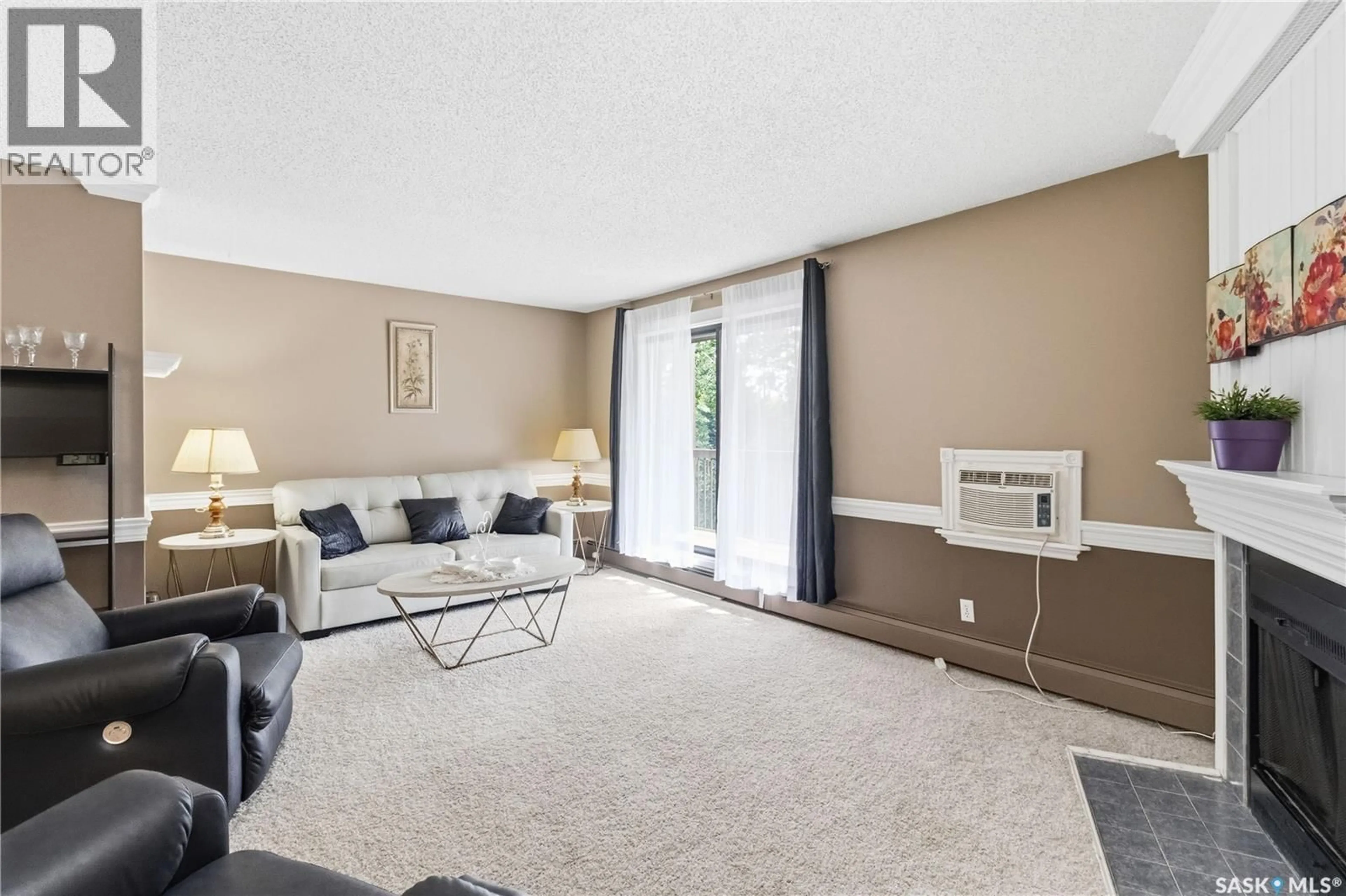 Living room with furniture, carpet floor for 203 - 365 KINGSMERE BOULEVARD, Saskatoon Saskatchewan S7J4J6