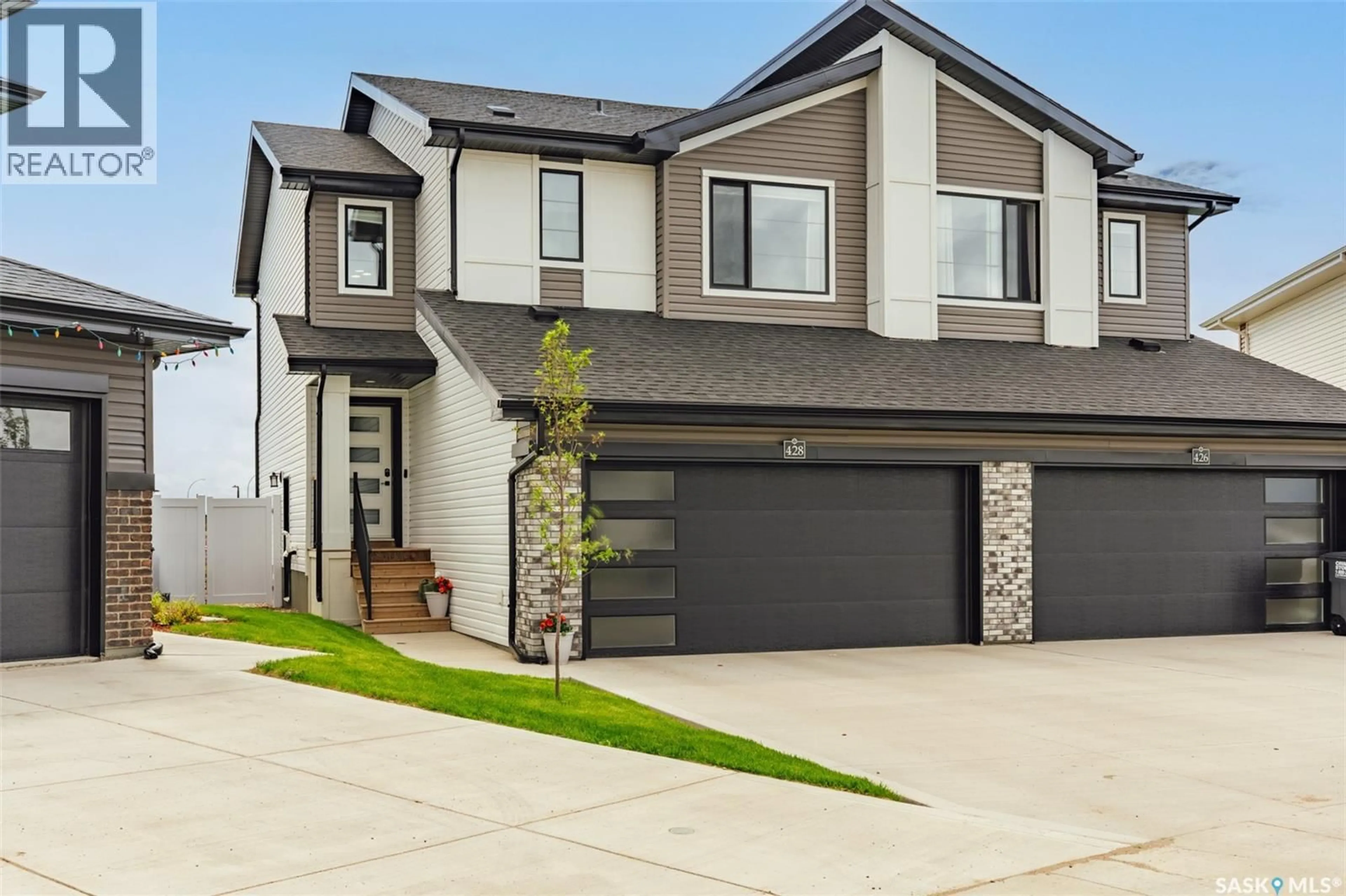 Home with vinyl exterior material, street for 428 MYLES HEIDT MANOR, Saskatoon Saskatchewan S7W0Z4