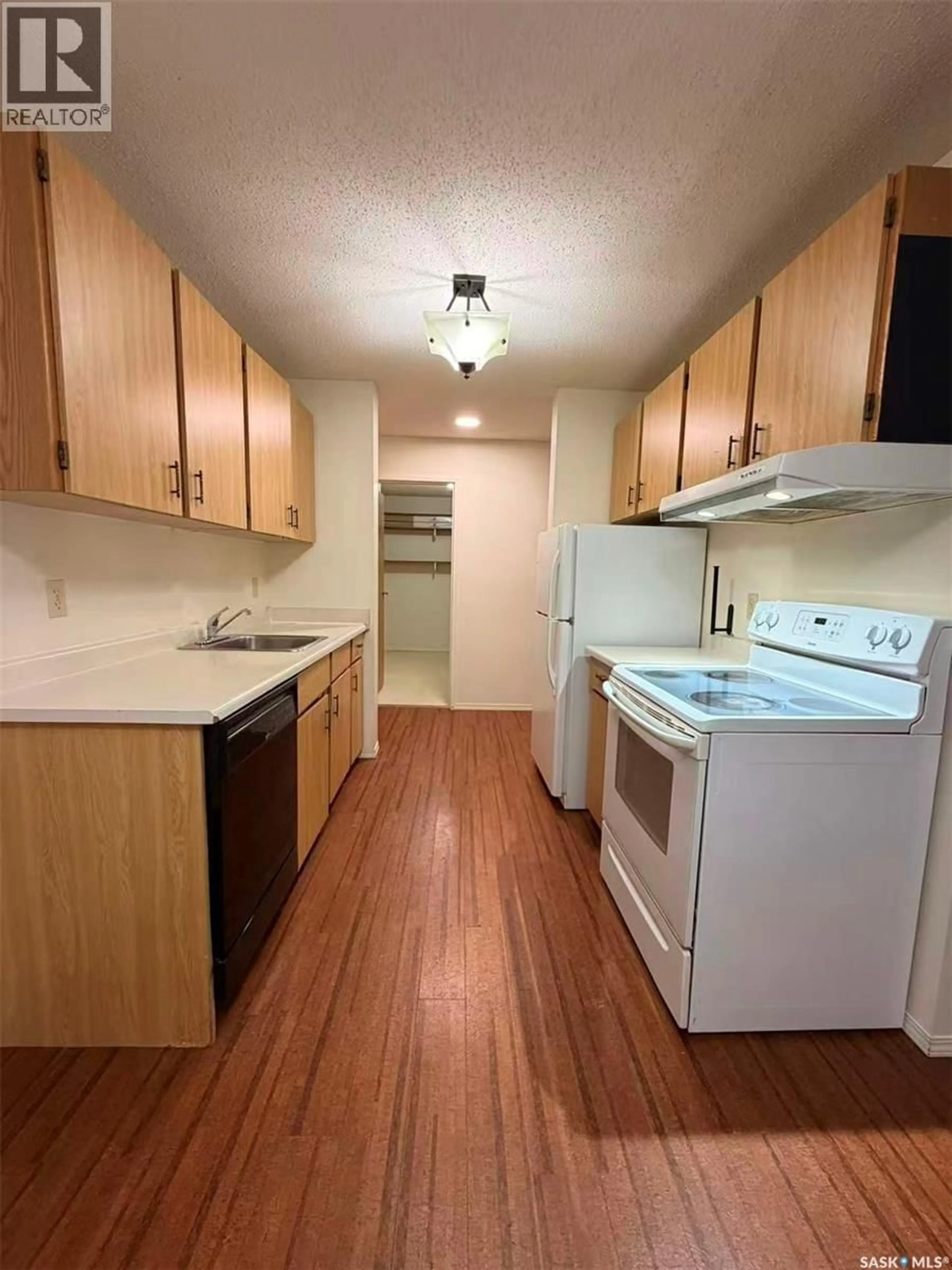 Standard kitchen, wood/laminate floor for 310 - 726 STILLWATER DRIVE, Saskatoon Saskatchewan S7J4H7