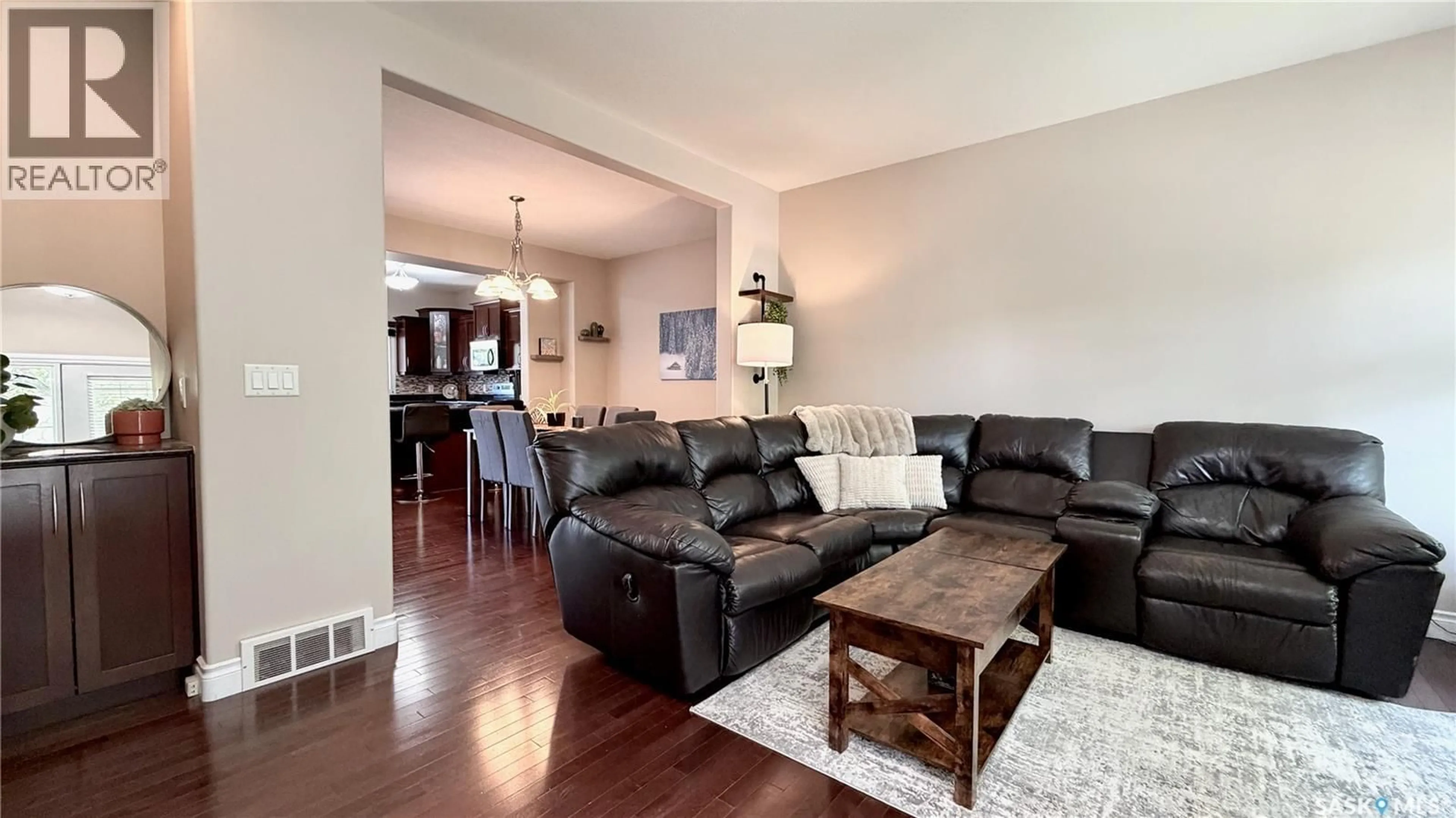 Living room with furniture, wood/laminate floor for 1233 13TH STREET, Saskatoon Saskatchewan S7H0C3