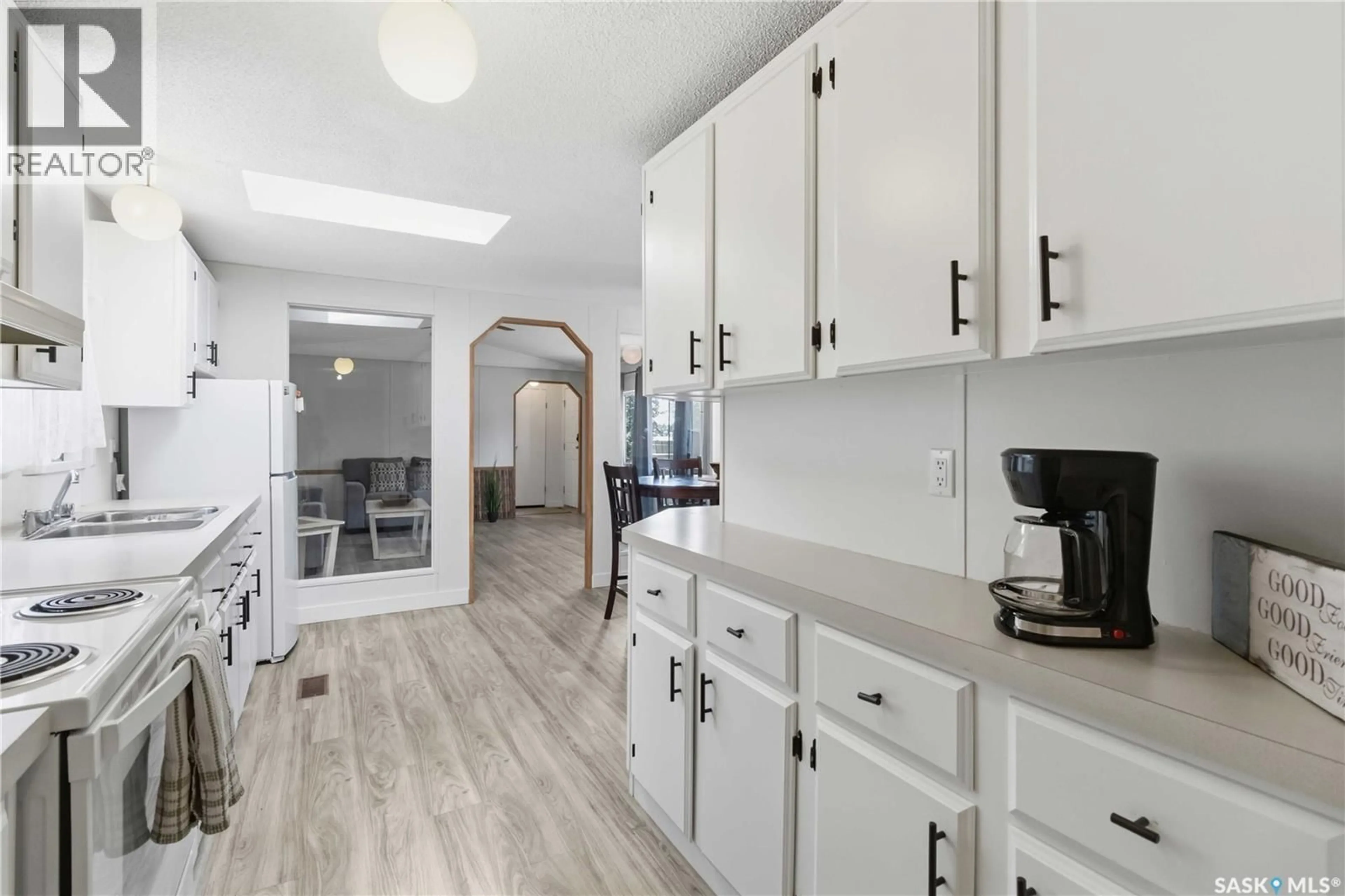 Open concept kitchen, ceramic/tile floor for 16 ARCHIE CLAMPITT DRIVE, Kivimaa-Moonlight Bay Saskatchewan S0M1J0