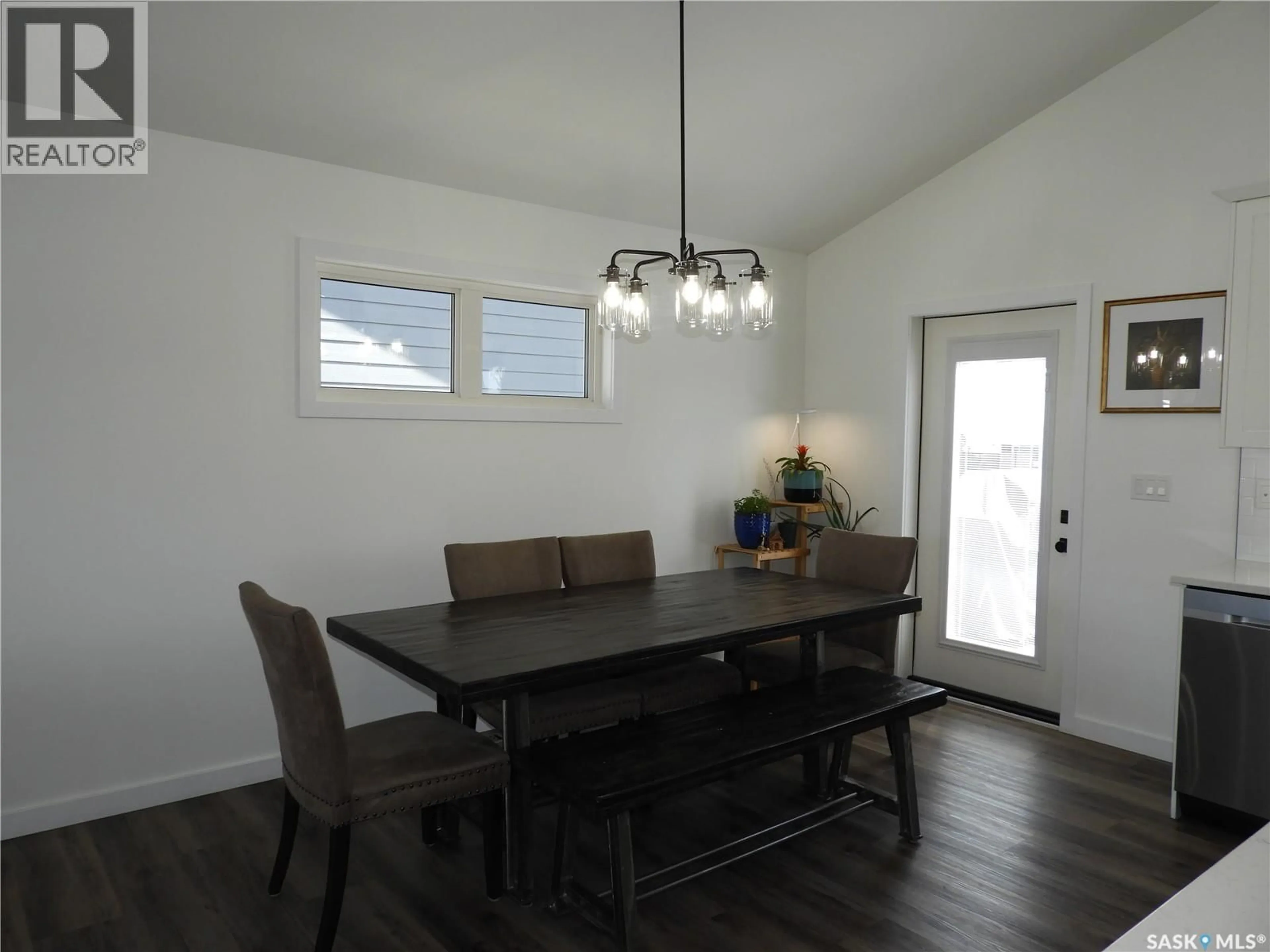 Dining room, wood/laminate floor for 715 SCOTT CRESCENT, Warman Saskatchewan S0K4S4