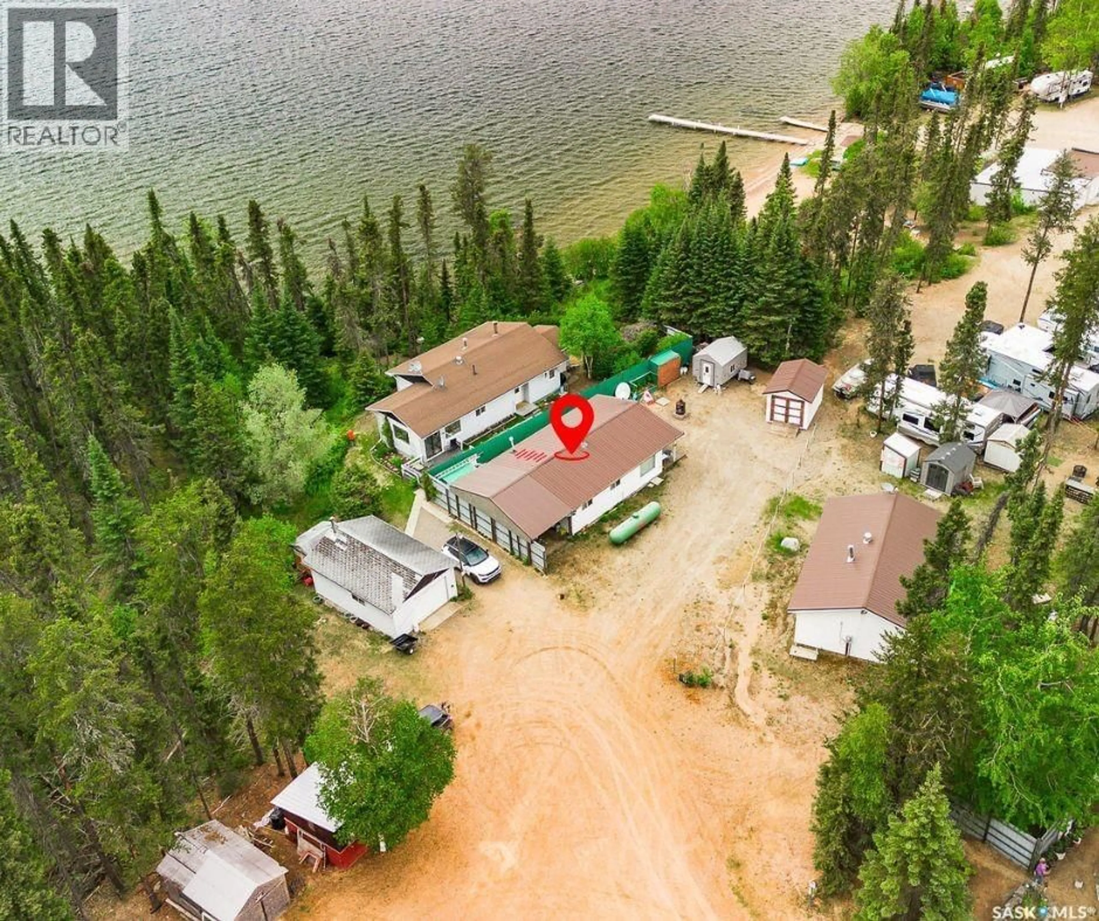 A pic from outside/outdoor area/front of a property/back of a property/a pic from drone, water/lake/river/ocean view for 6 PETERSON PLACE, Northern Admin District Saskatchewan S0J2J0