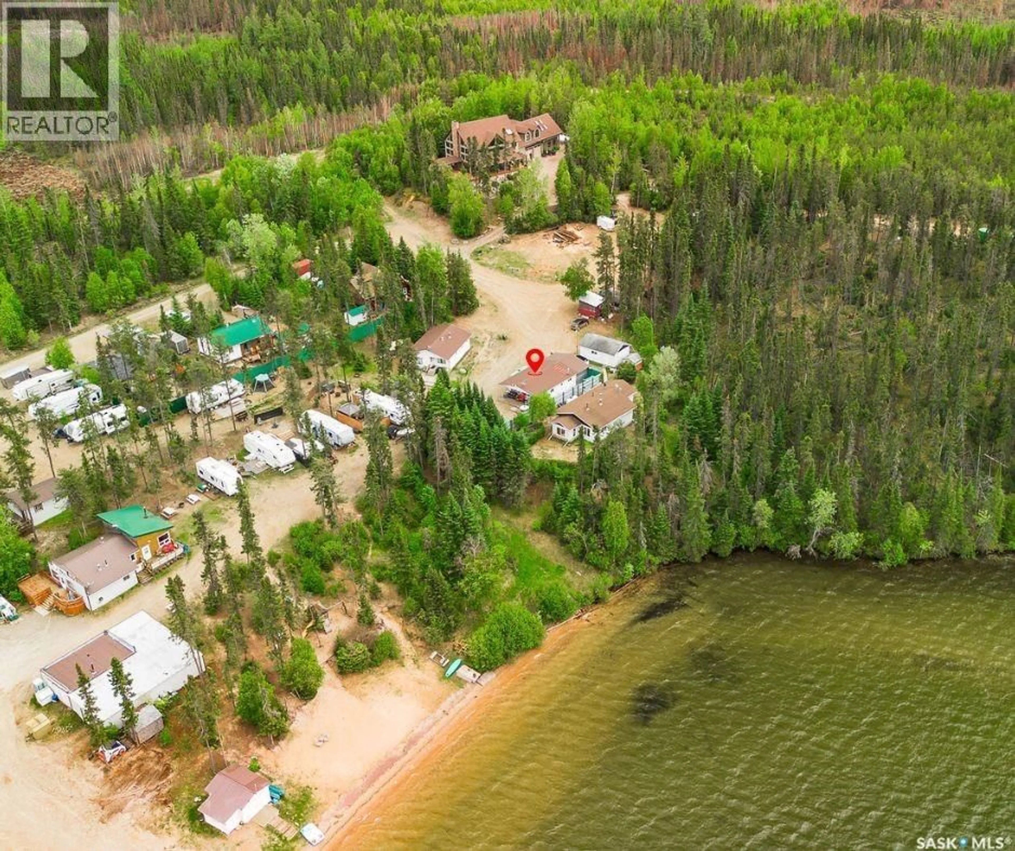 A pic from outside/outdoor area/front of a property/back of a property/a pic from drone, water/lake/river/ocean view for 6 PETERSON PLACE, Northern Admin District Saskatchewan S0J2J0
