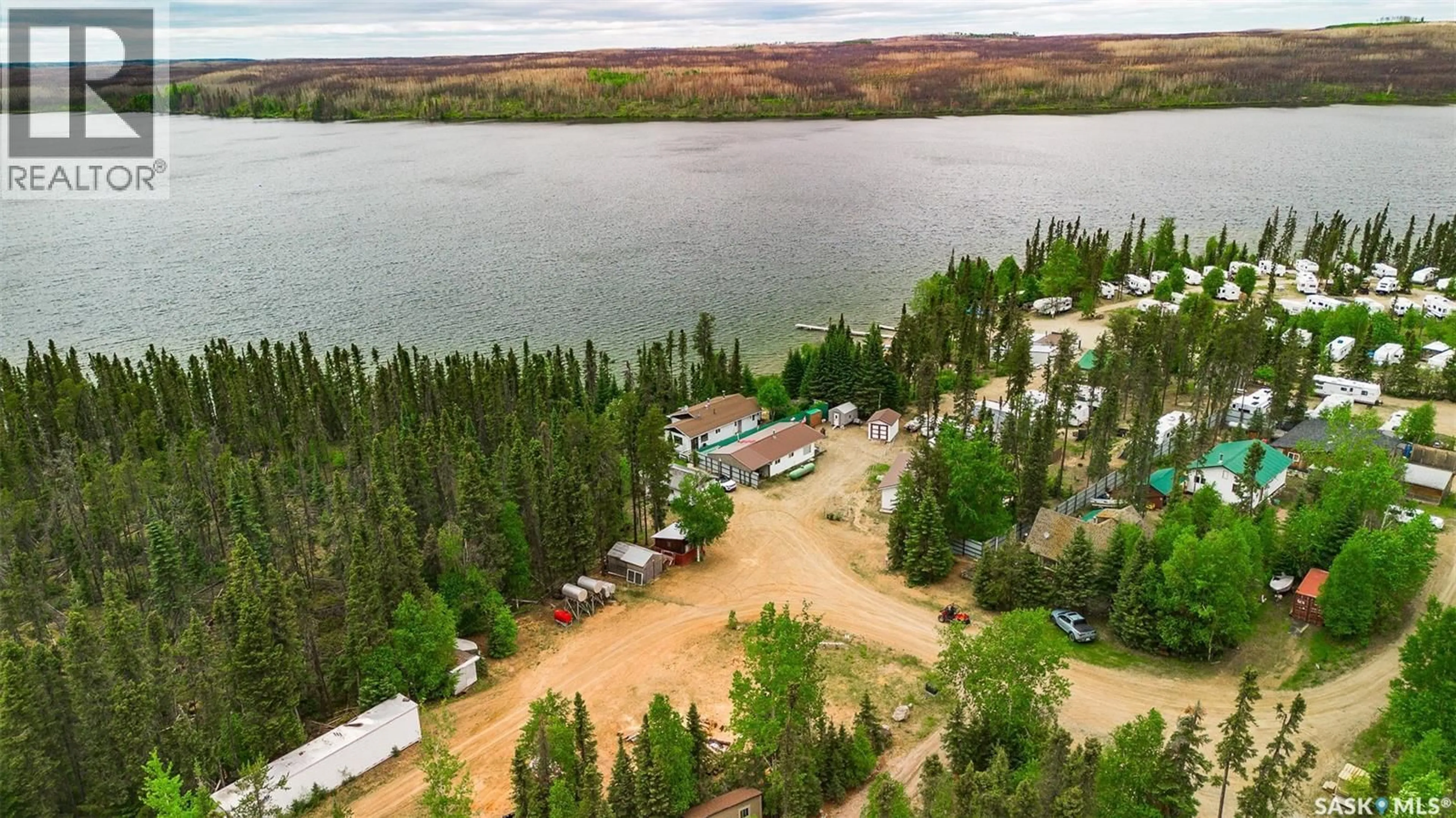 A pic from outside/outdoor area/front of a property/back of a property/a pic from drone, water/lake/river/ocean view for 6 PETERSON PLACE, Northern Admin District Saskatchewan S0J2J0