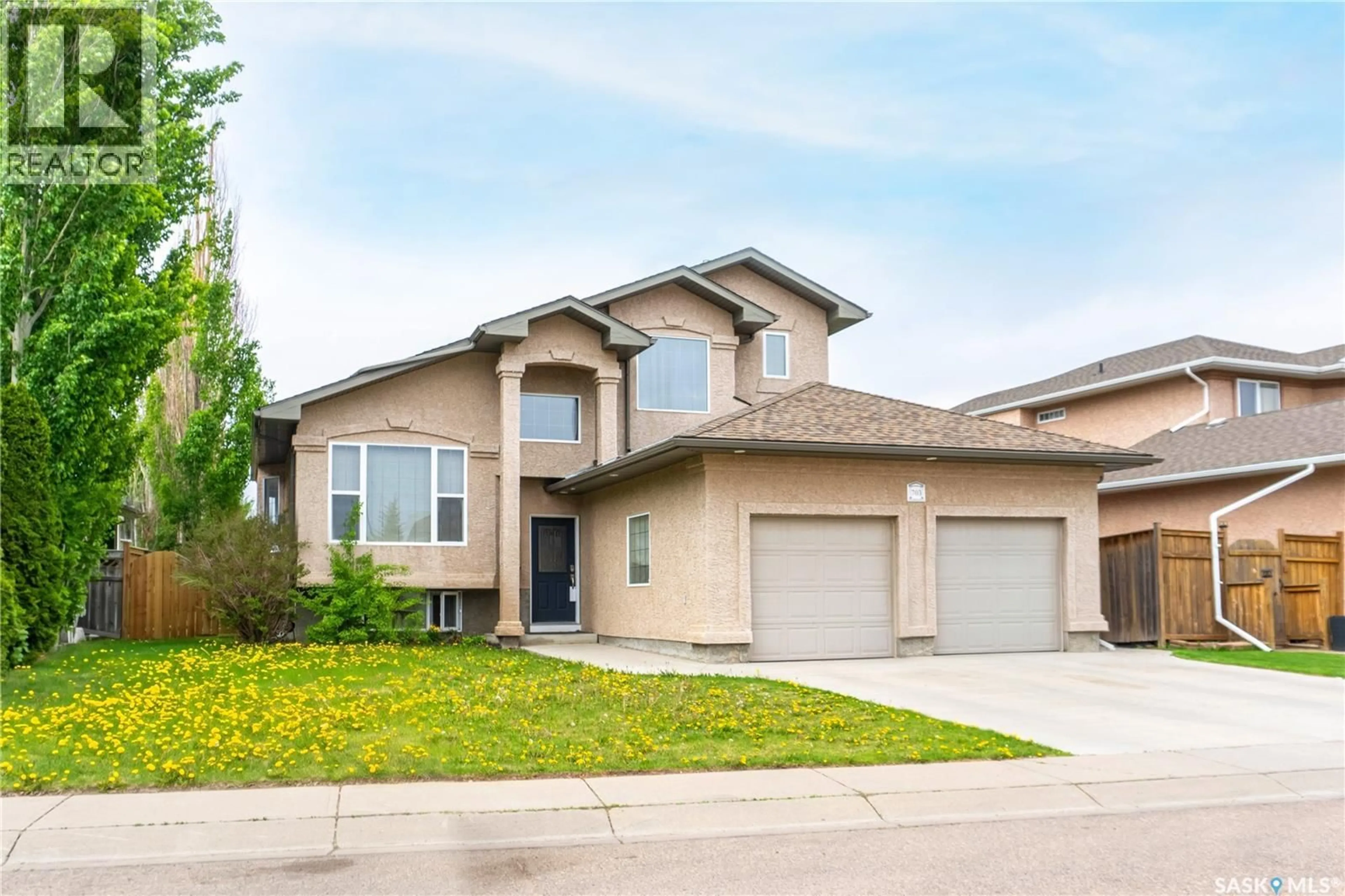 Home with brick exterior material, street for 703 BEECHMONT LANE, Saskatoon Saskatchewan S7V1C9