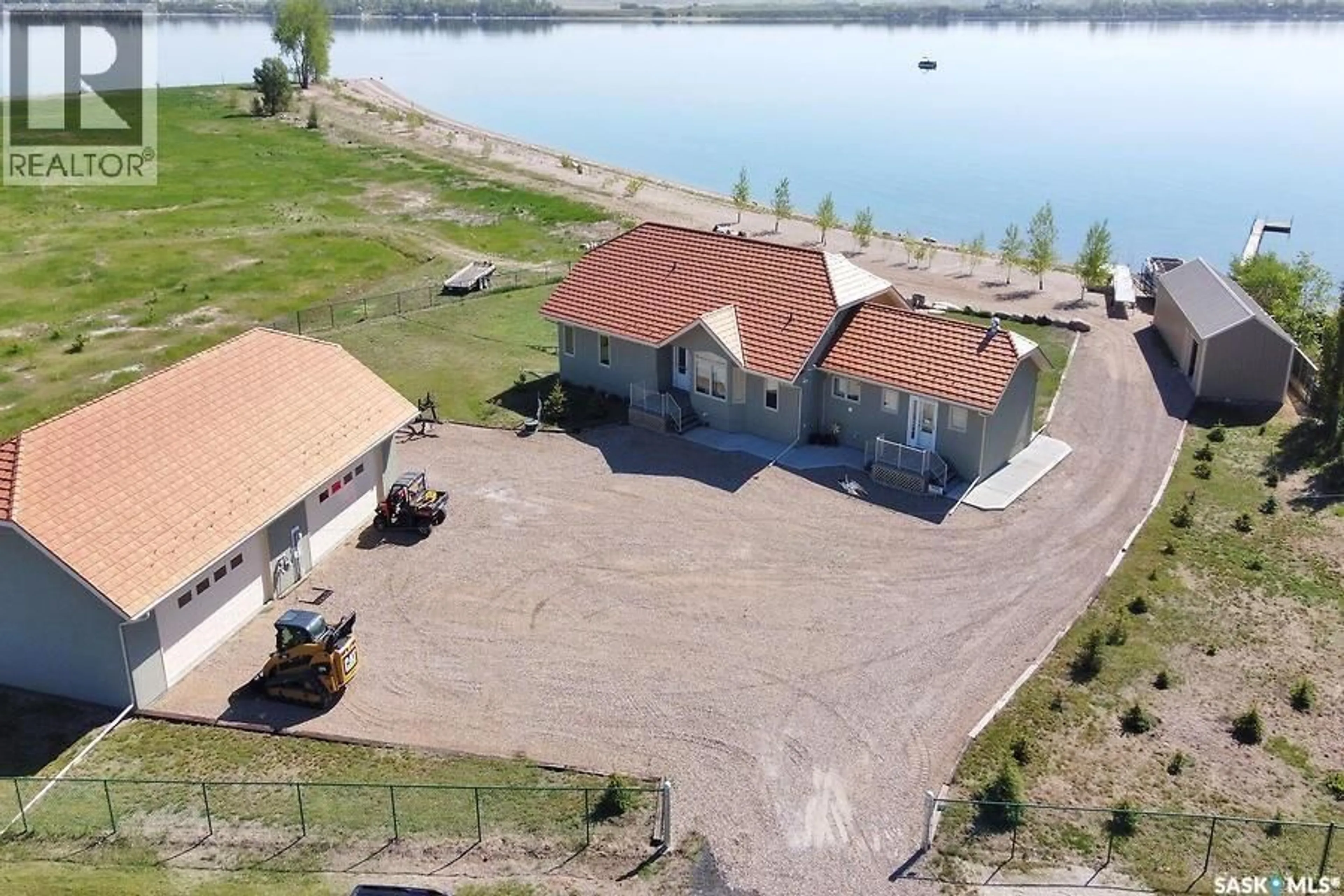 A pic from outside/outdoor area/front of a property/back of a property/a pic from drone, water/lake/river/ocean view for 400 LAKESHORE DRIVE, Wee Too Beach Saskatchewan S0G1C0