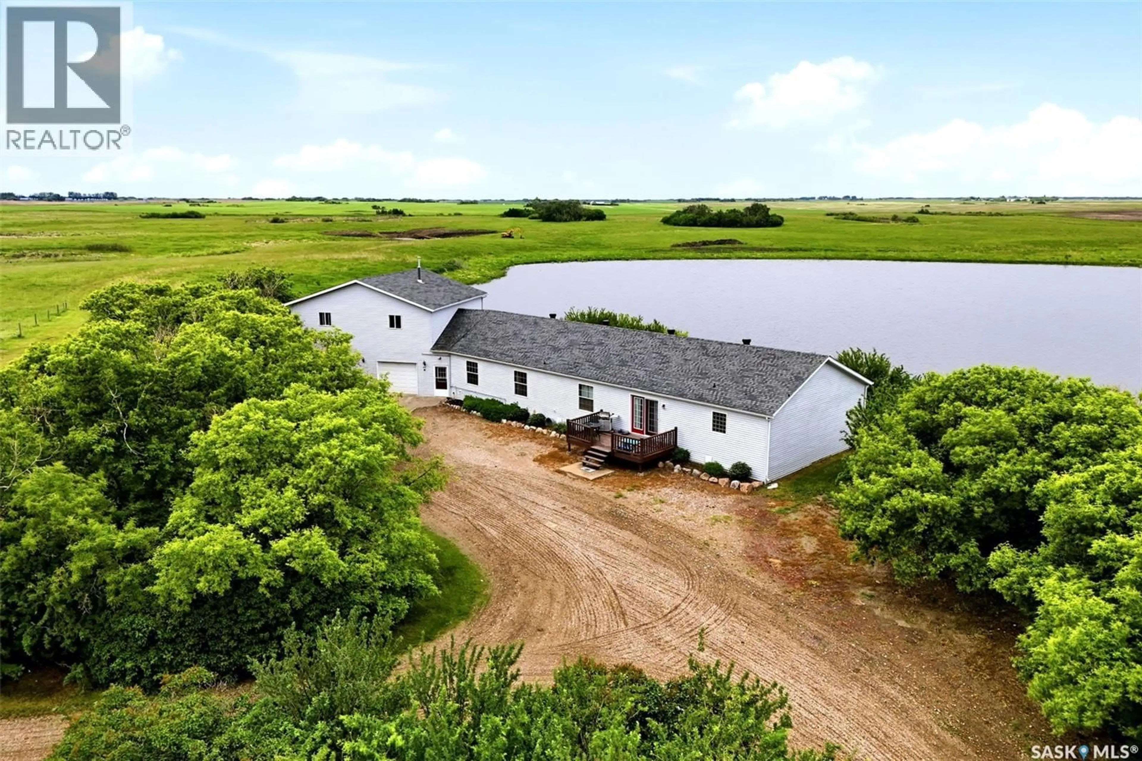 A pic from outside/outdoor area/front of a property/back of a property/a pic from drone, water/lake/river/ocean view for 70.67 SOUTHEY ACREAGE, Longlaketon Rm No. 219 Saskatchewan S0G4P0