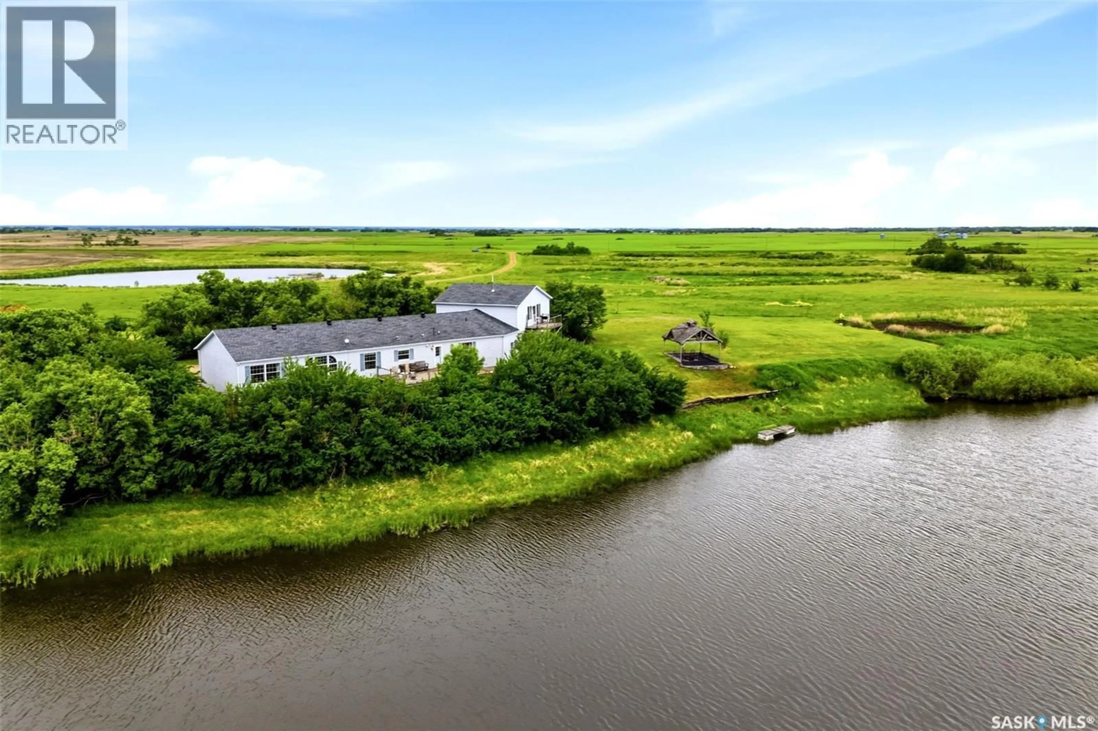 A pic from outside/outdoor area/front of a property/back of a property/a pic from drone, water/lake/river/ocean view for 70.67 SOUTHEY ACREAGE, Longlaketon Rm No. 219 Saskatchewan S0G4P0