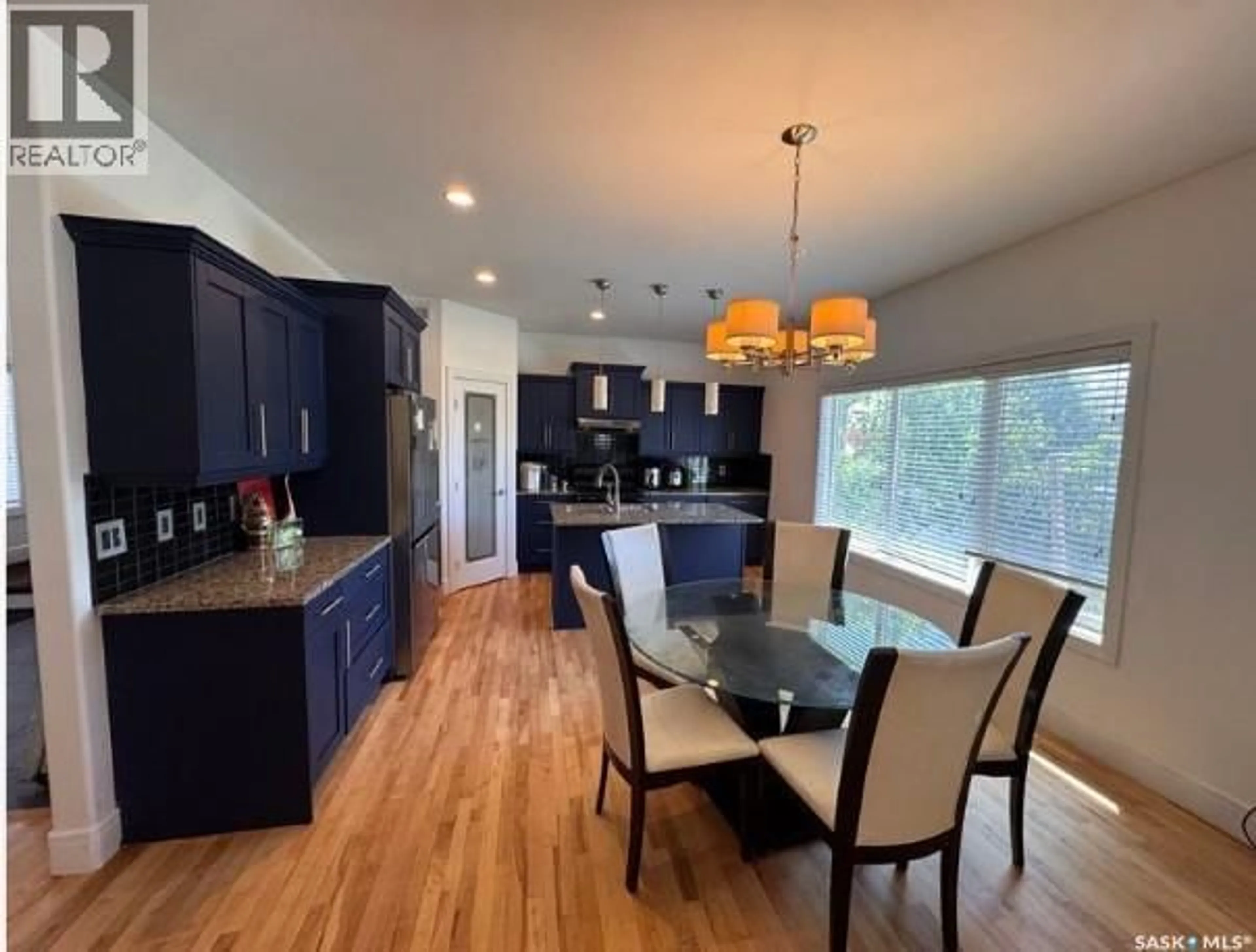 Open concept kitchen, wood/laminate floor for 242 POHORECKY STREET, Saskatoon Saskatchewan S7W0J3