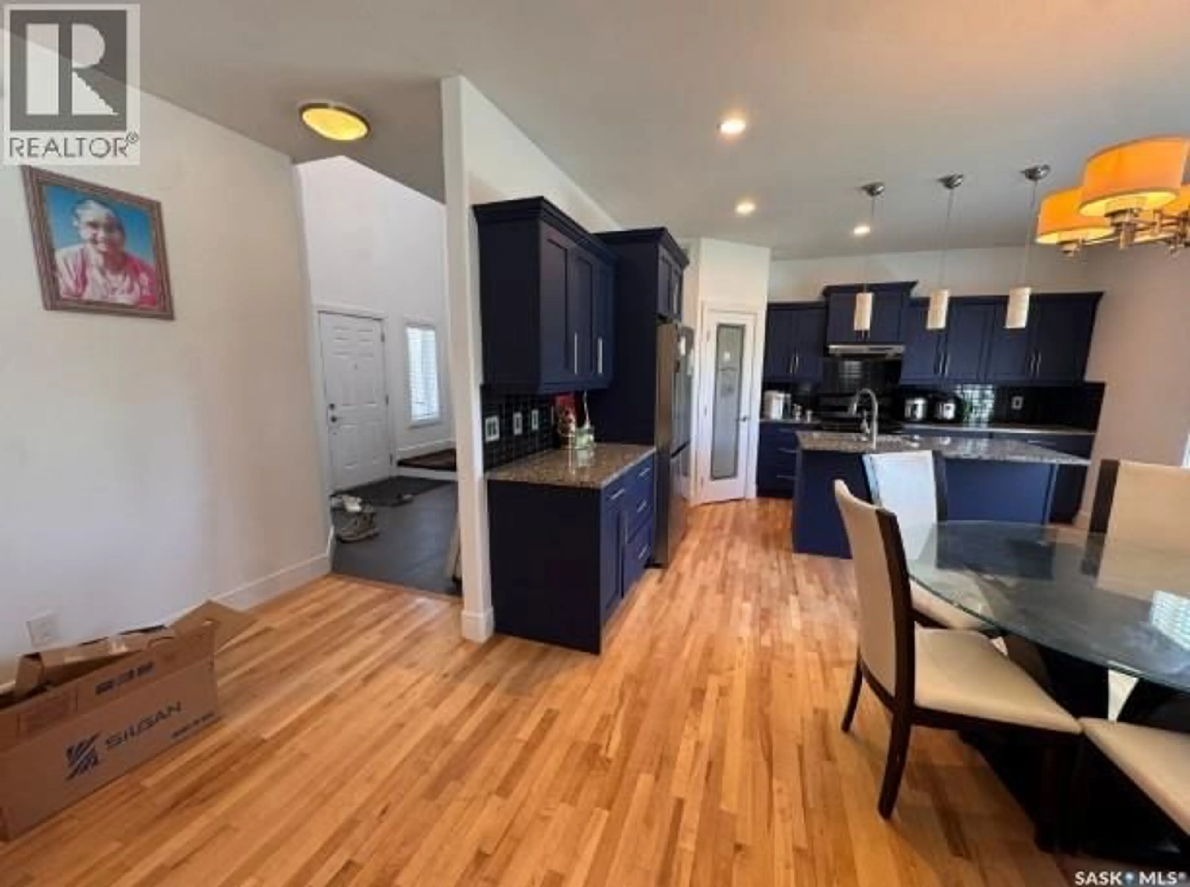 Open concept kitchen, wood/laminate floor for 242 POHORECKY STREET, Saskatoon Saskatchewan S7W0J3