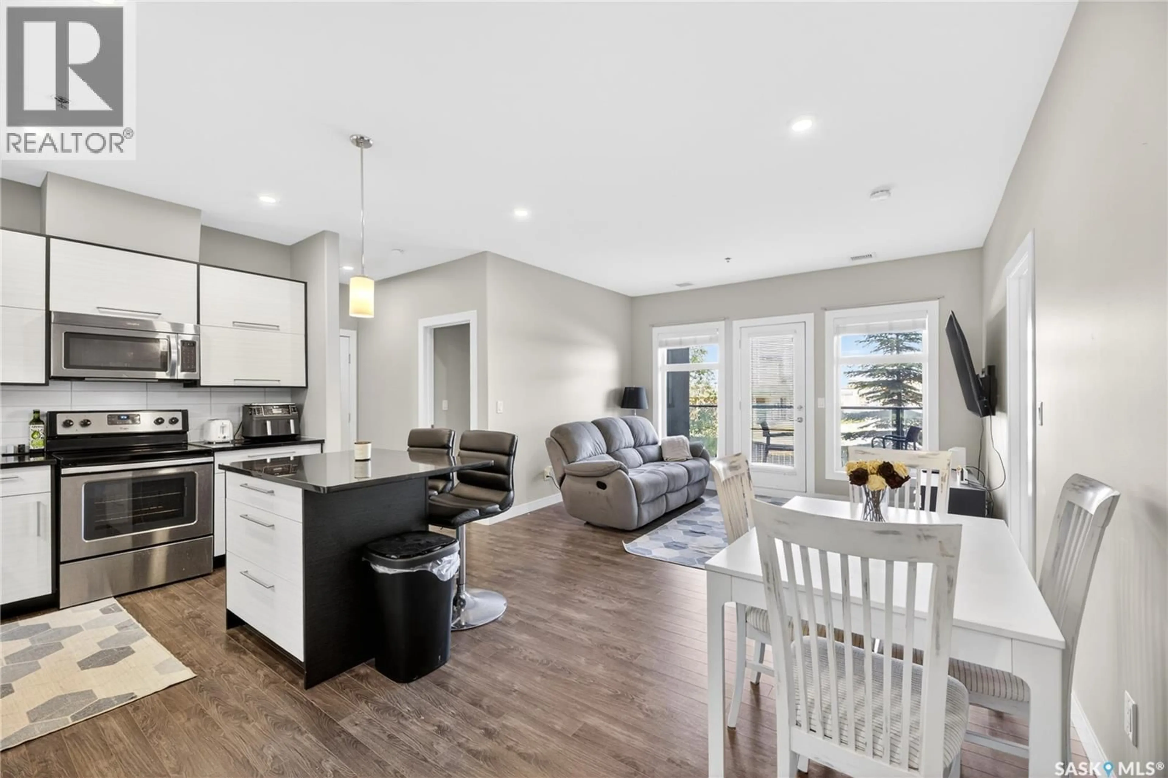 Open concept kitchen, wood/laminate floor for 109 - 502 PEREHUDOFF CRESCENT, Saskatoon Saskatchewan S7N4H6