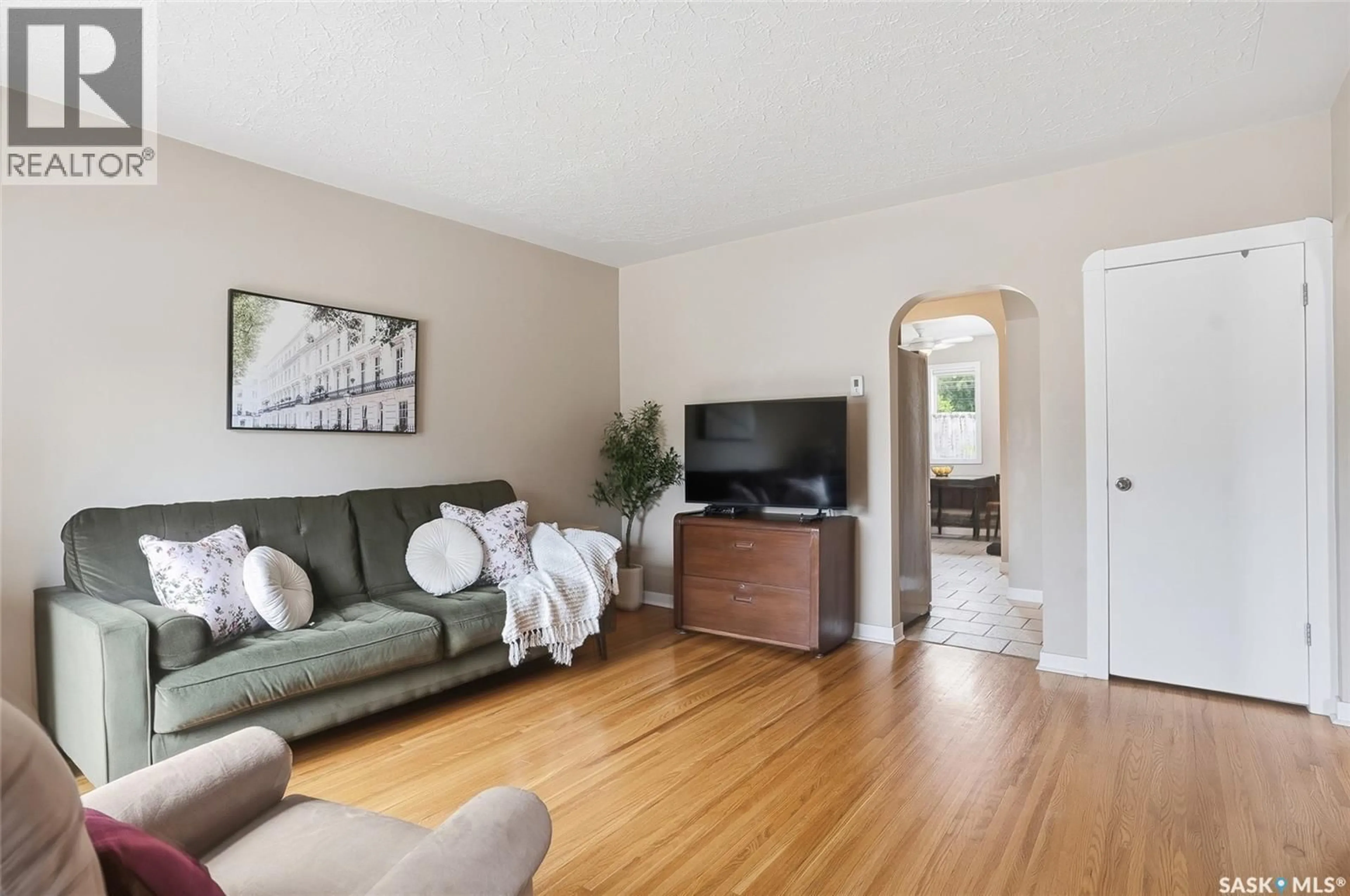 Living room with furniture, wood/laminate floor for 1139 2ND STREET, Saskatoon Saskatchewan S7H1R4