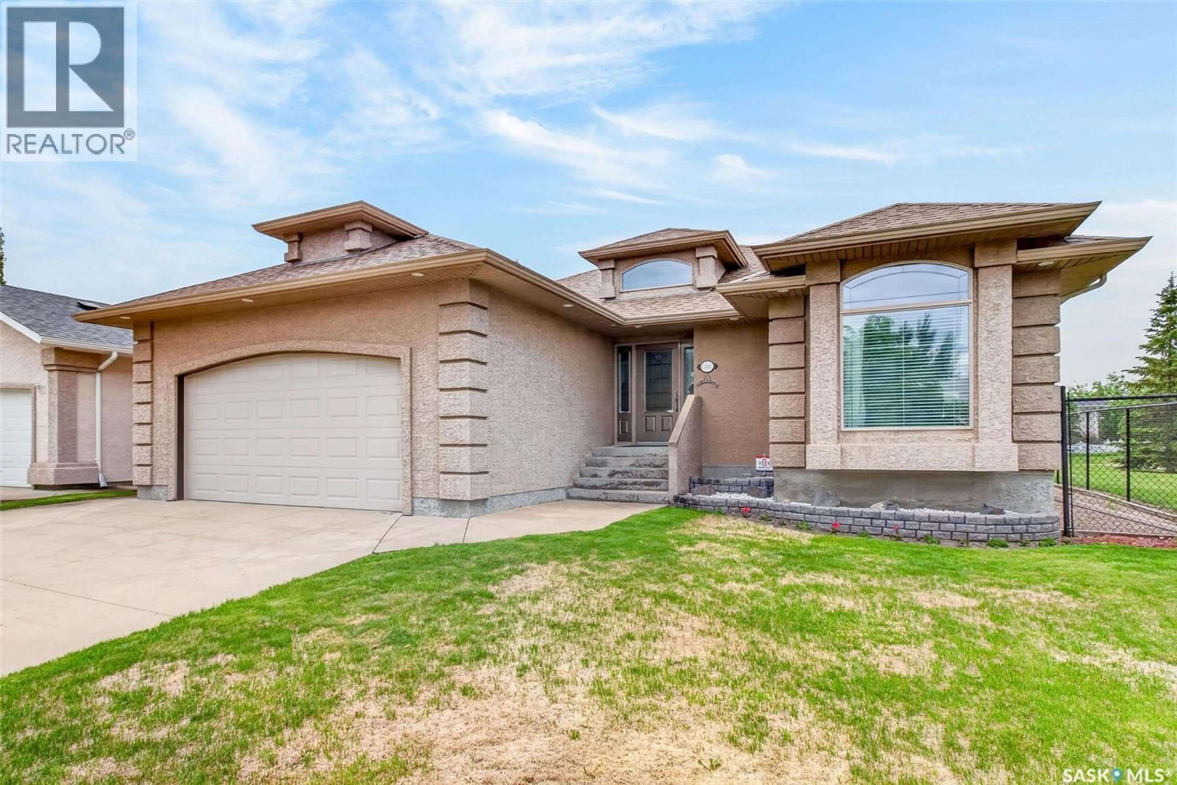 Home with brick exterior material, street for 1 TELFER BAY, Prince Albert Saskatchewan S6X1C4