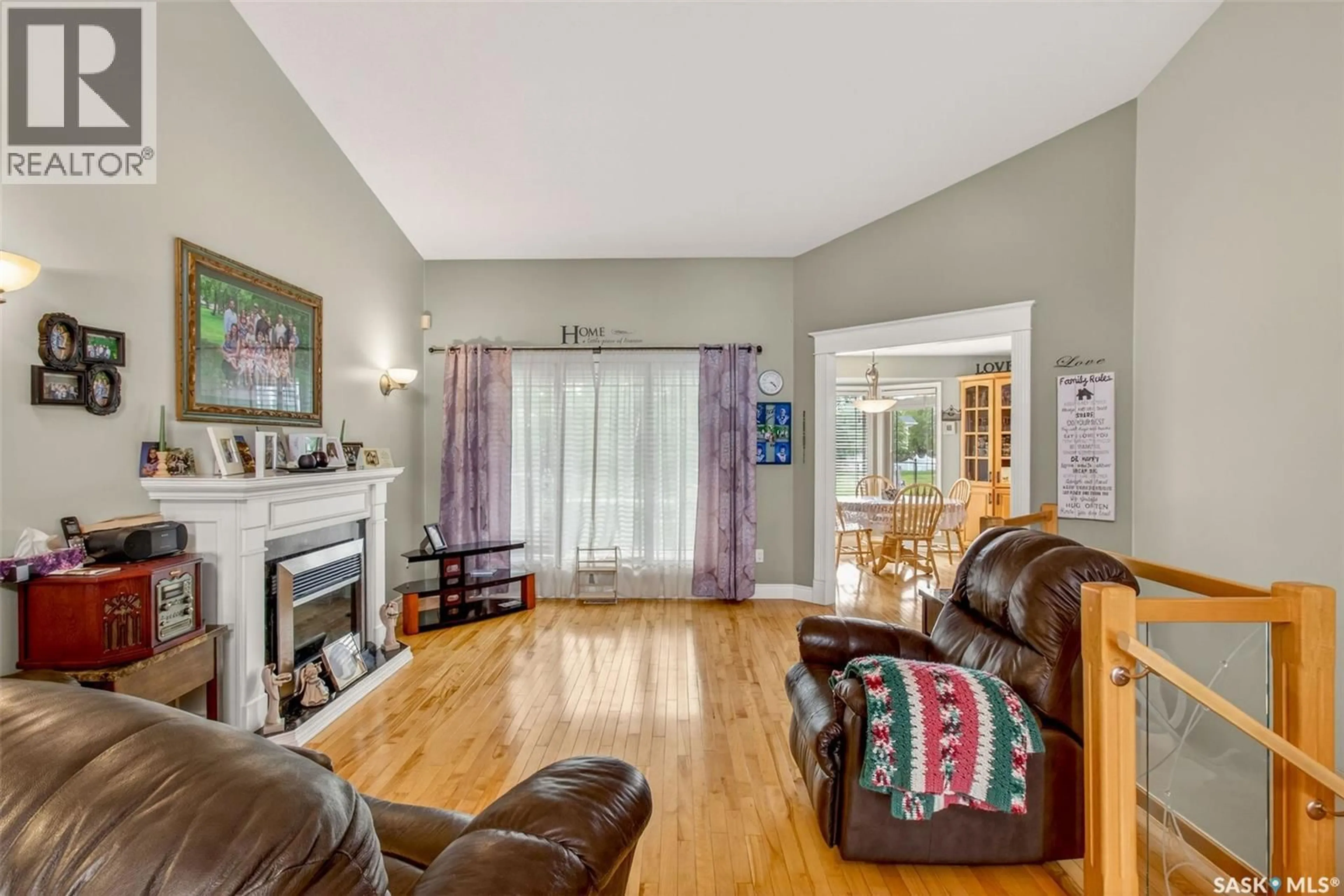 Living room with furniture, wood/laminate floor for 1 TELFER BAY, Prince Albert Saskatchewan S6X1C4