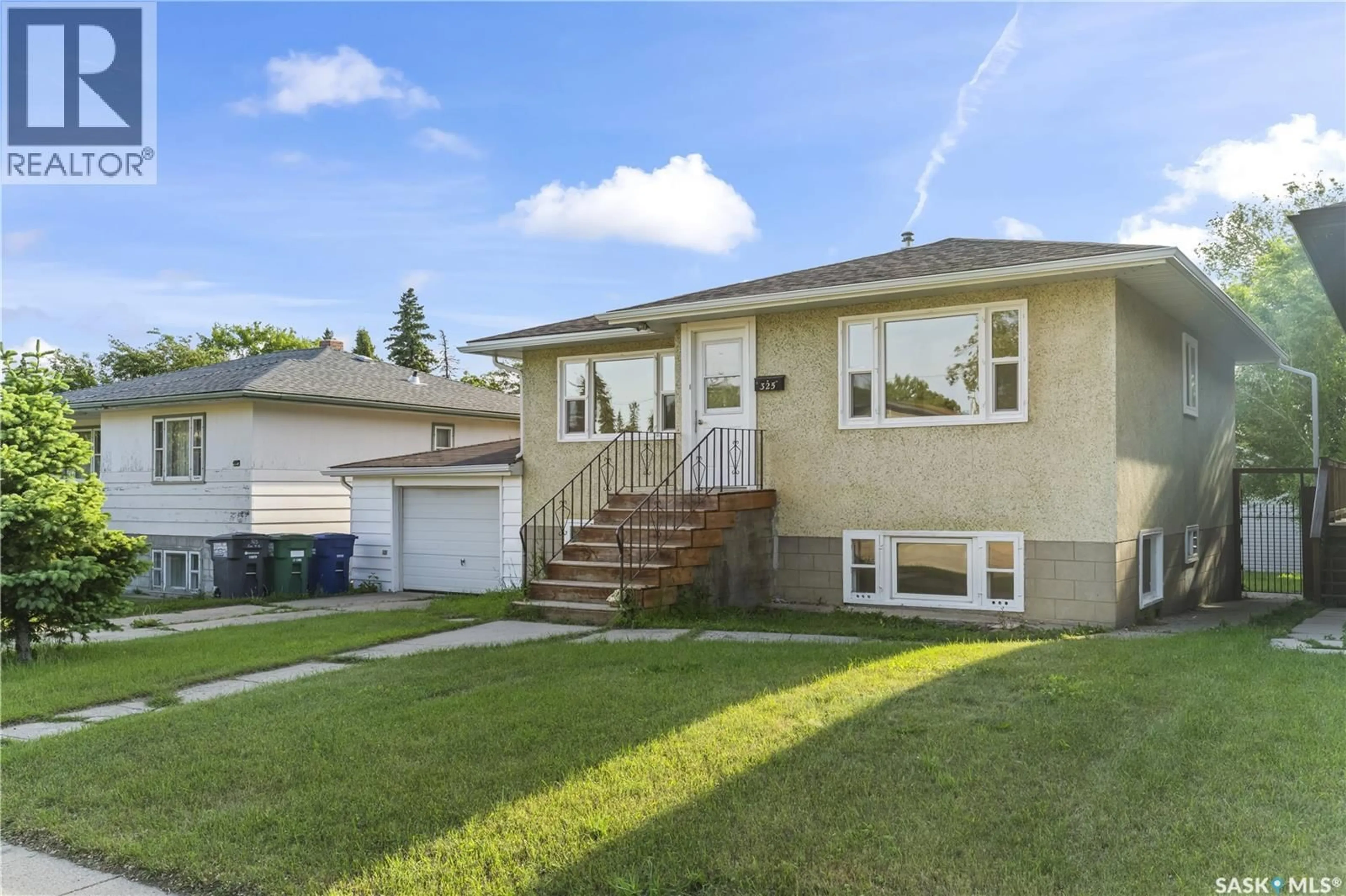 Home with vinyl exterior material, street for 325 V AVENUE, Saskatoon Saskatchewan S7M3E4