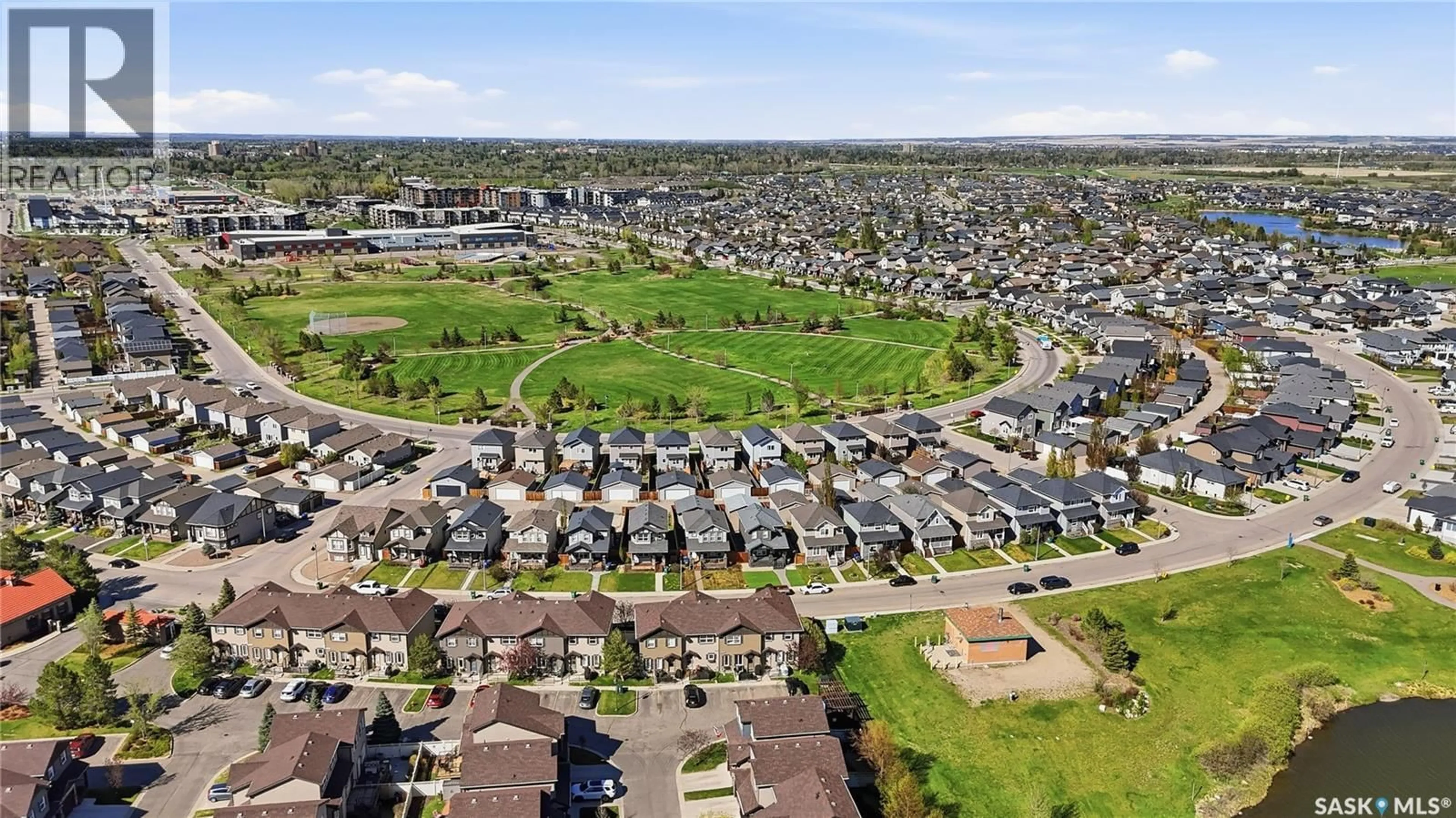 A pic from outside/outdoor area/front of a property/back of a property/a pic from drone, street for 224 LANGLOIS WAY, Saskatoon Saskatchewan S7T0L2