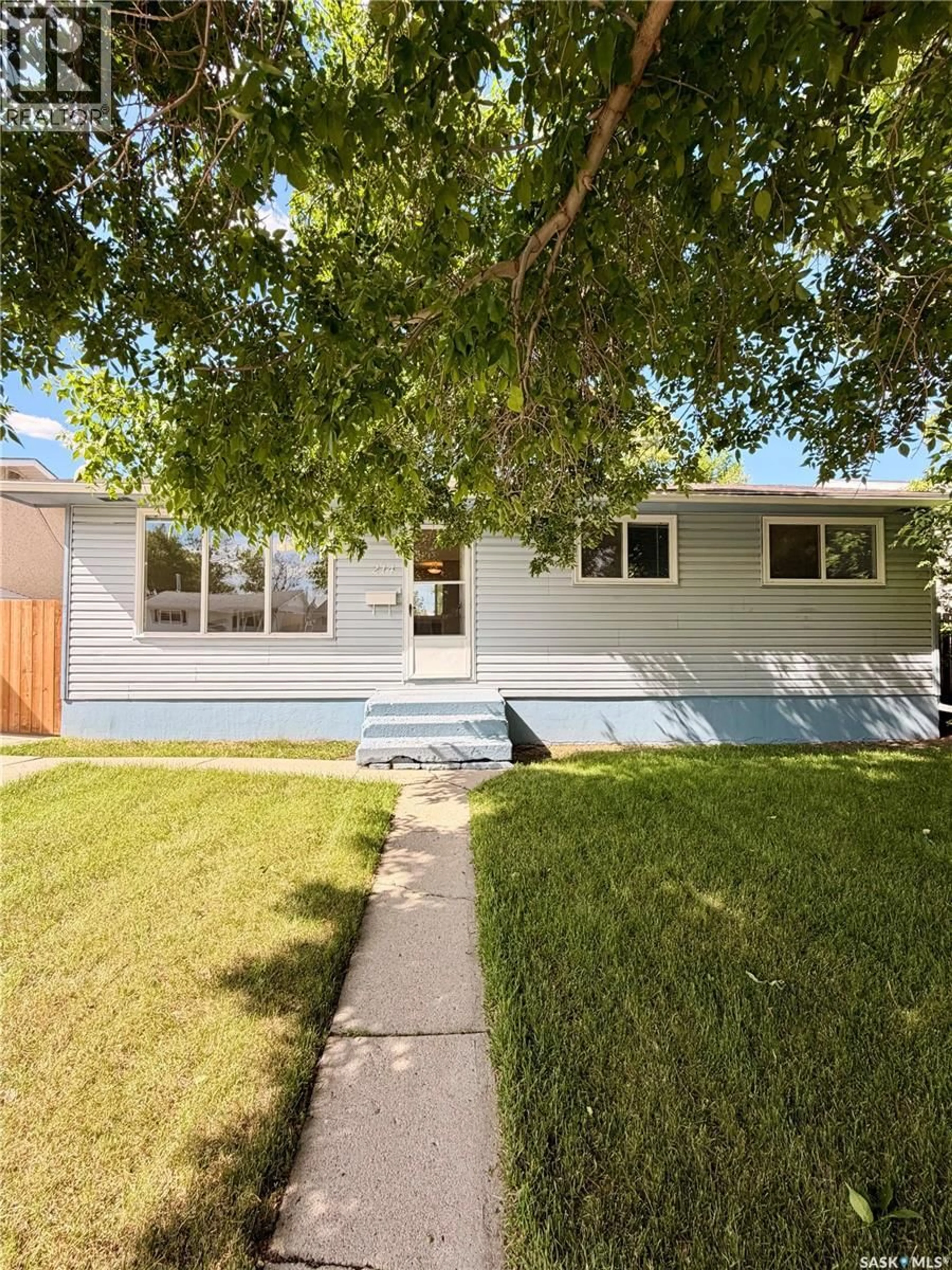 Home with vinyl exterior material, street for 214 FISHER CRESCENT, Saskatoon Saskatchewan S7L5C9