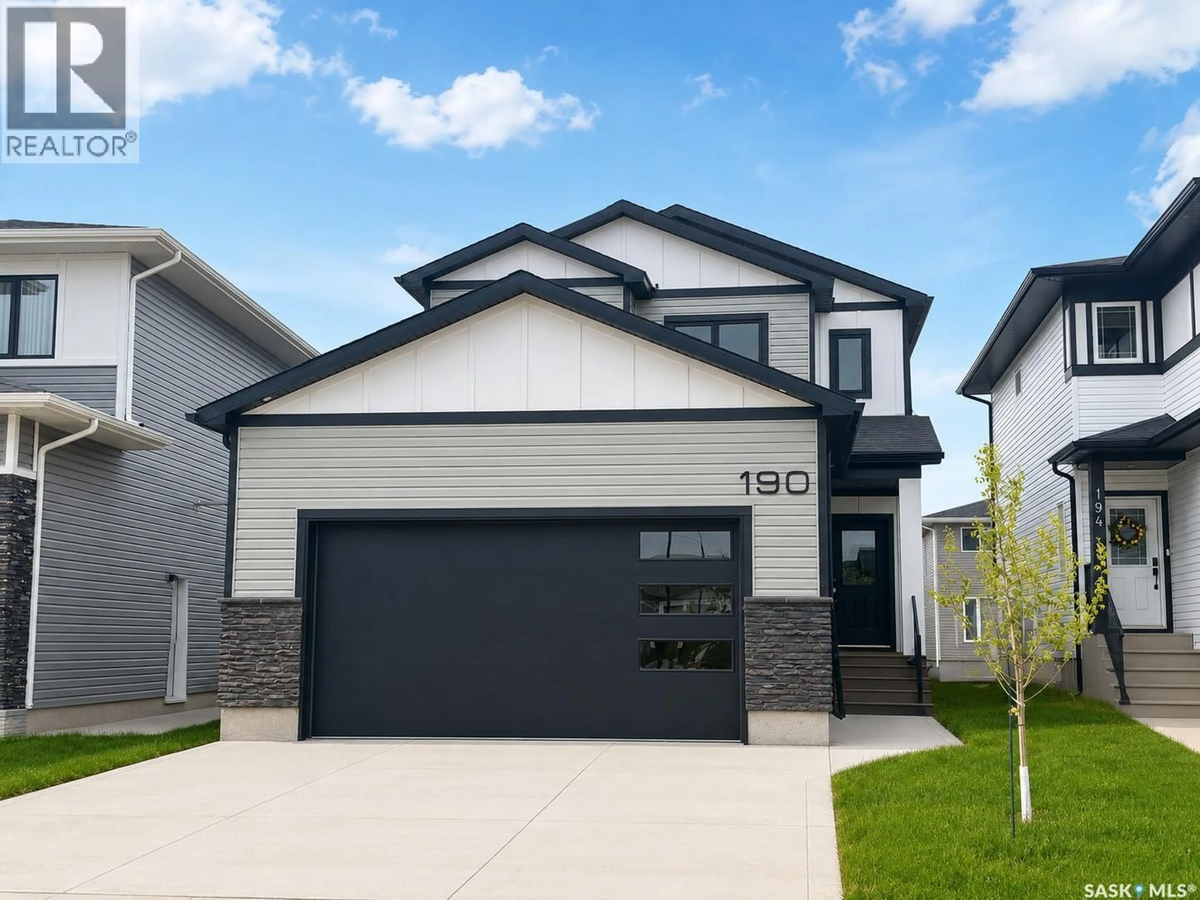 Home with vinyl exterior material, street for 190 DORAN WAY, Saskatoon Saskatchewan S7V0Z7