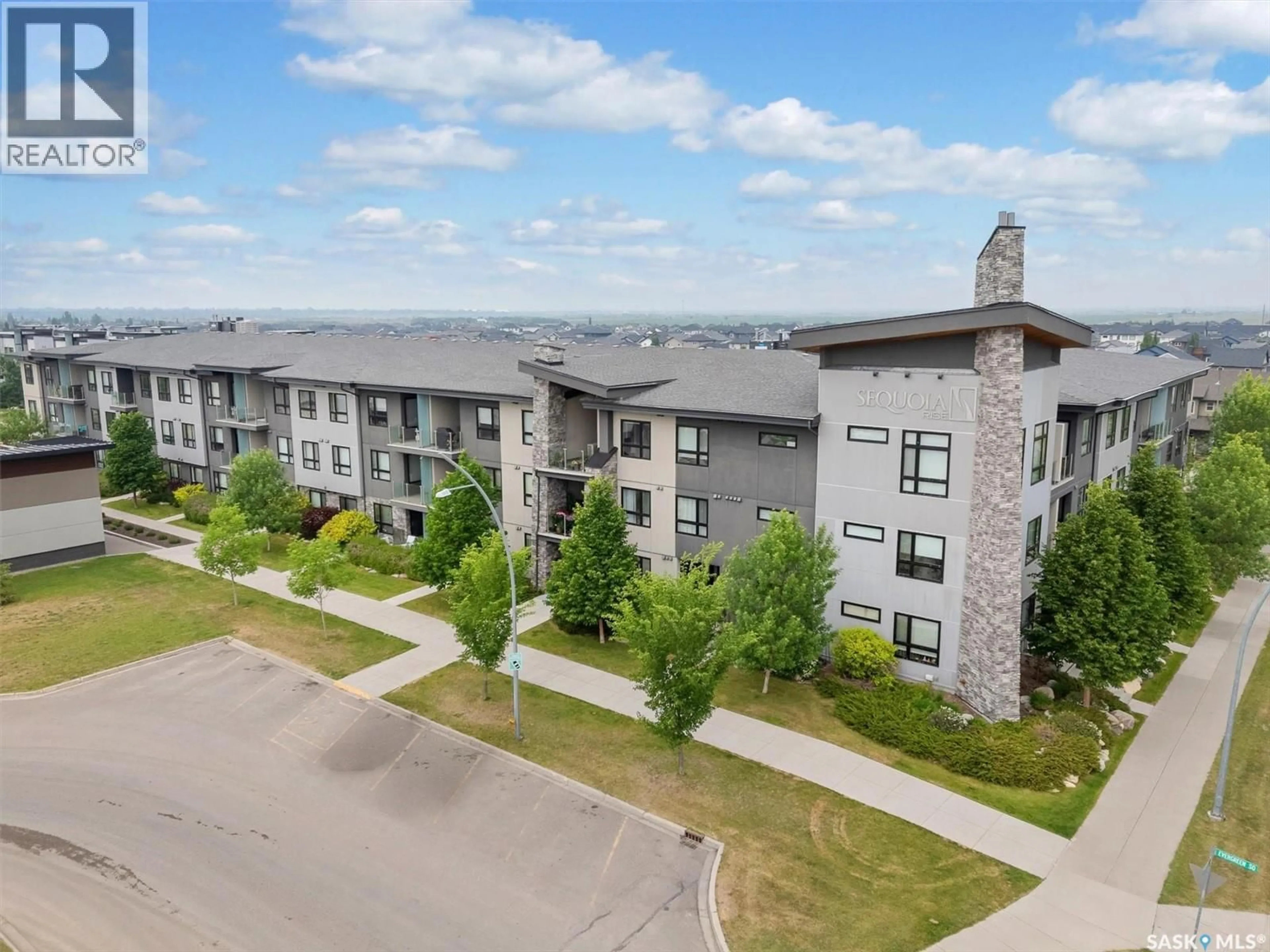 A pic from outside/outdoor area/front of a property/back of a property/a pic from drone, unknown for 222 235 EVERGREEN SQUARE, Saskatoon Saskatchewan S7W0T9
