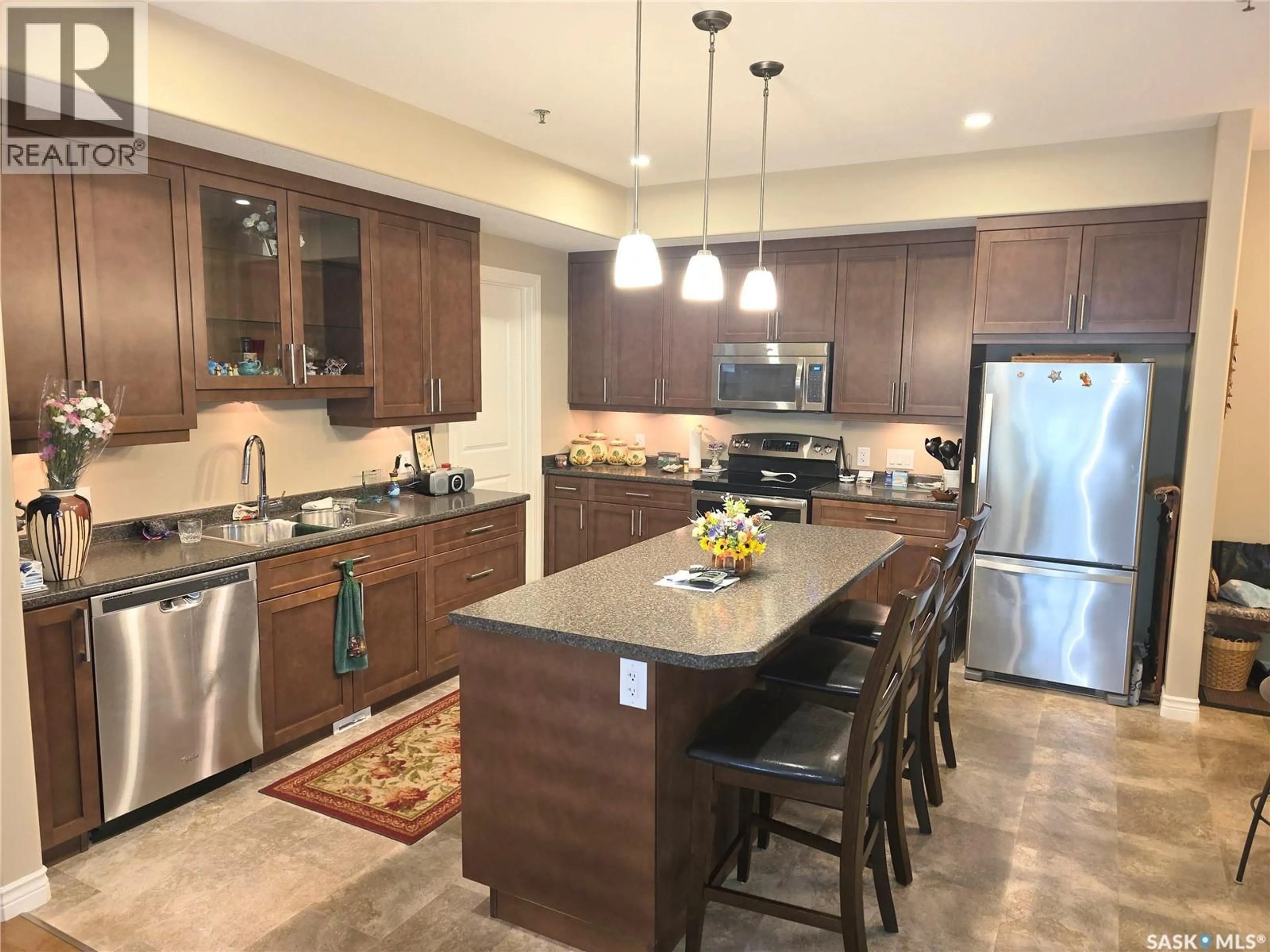 Open concept kitchen, ceramic/tile floor for 203 - 510 4TH AVENUE, Rosthern Saskatchewan S0K3R0