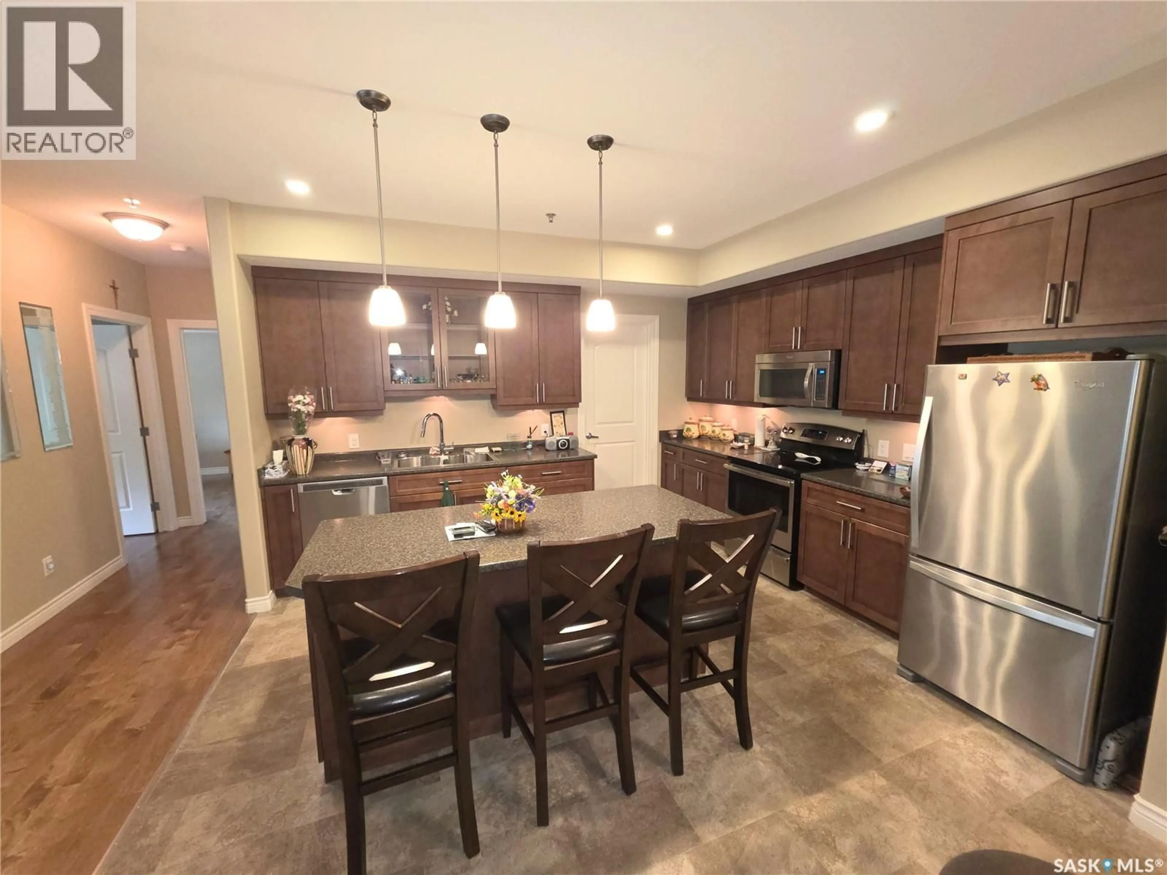 Open concept kitchen, ceramic/tile floor for 203 - 510 4TH AVENUE, Rosthern Saskatchewan S0K3R0