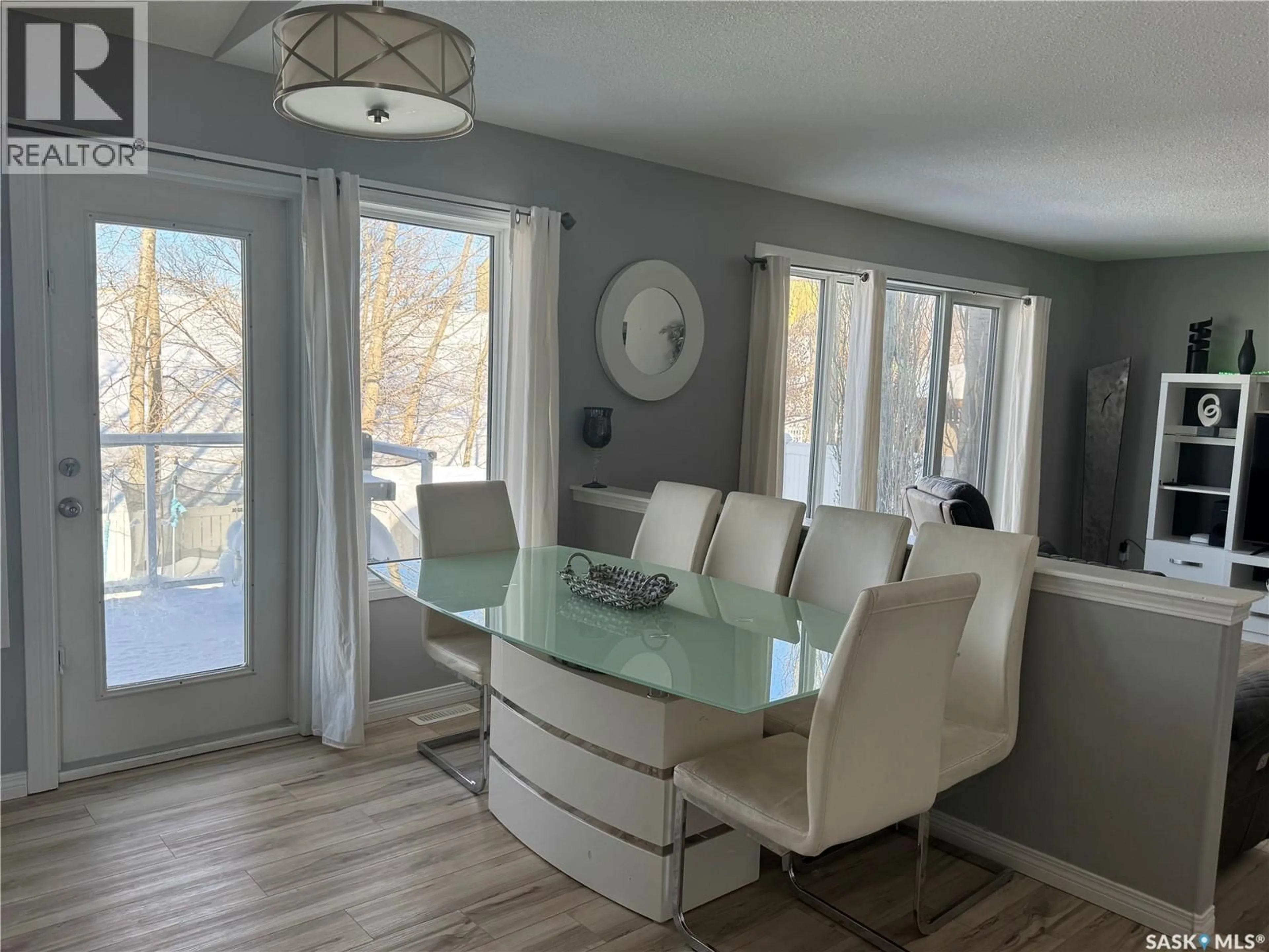 Dining room, wood/laminate floor for 509 MEADOW ROAD, Pilot Butte Saskatchewan S0G3Z0