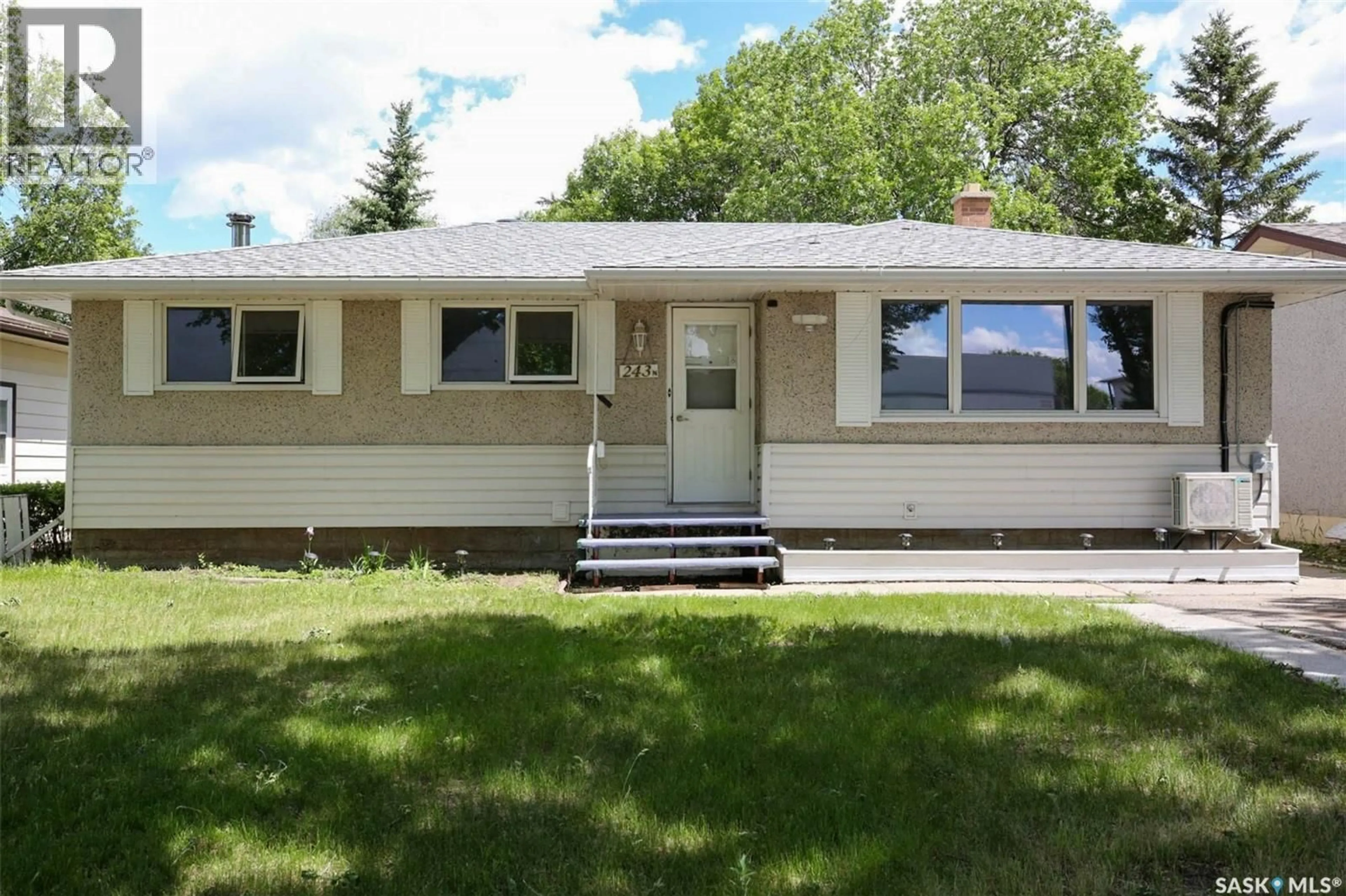 Home with vinyl exterior material, street for 243 SMITH STREET, Regina Saskatchewan S4R3B5