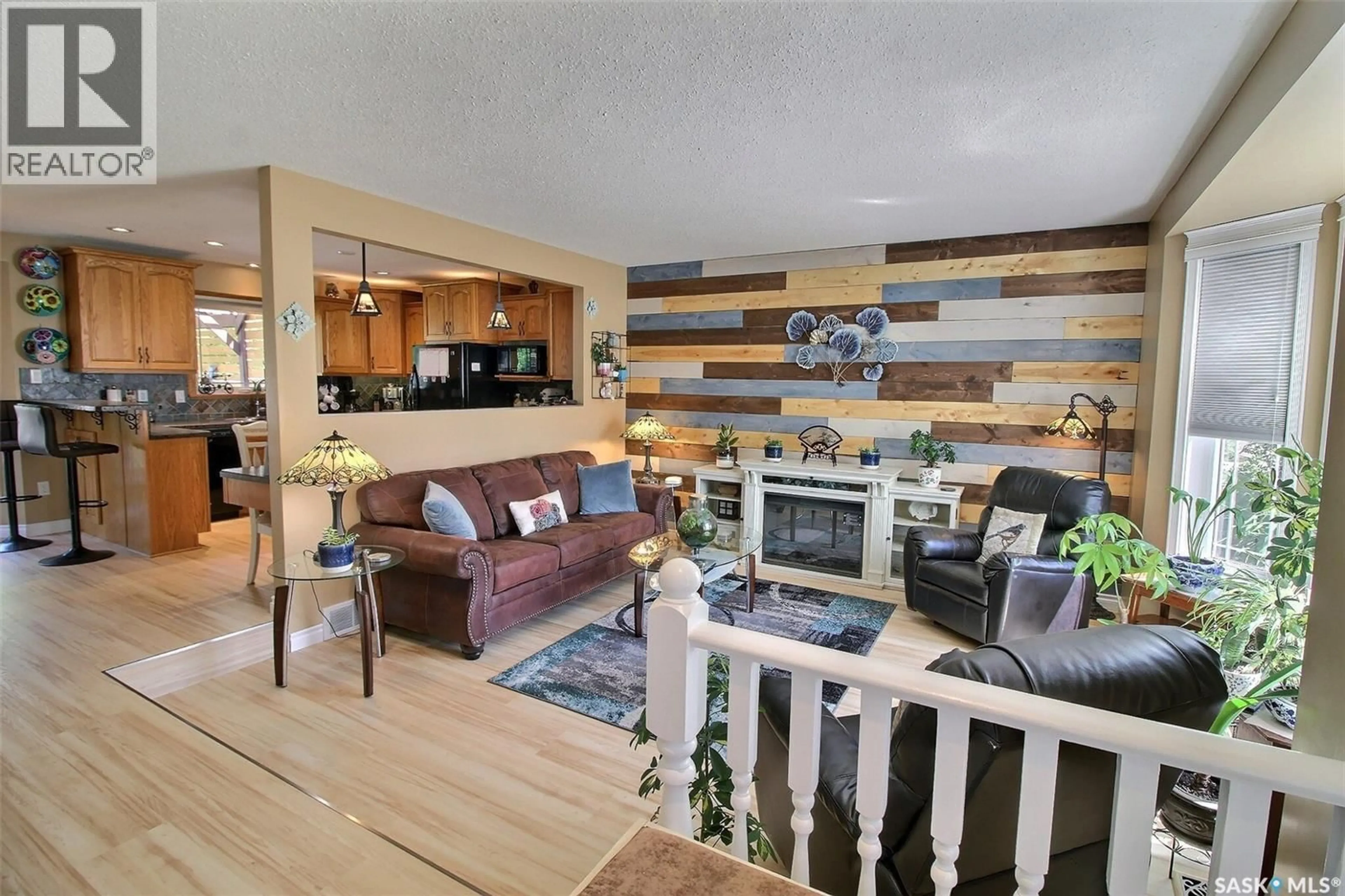 Living room with furniture, wood/laminate floor for 10 PEREVERZOFF PLACE, Prince Albert Saskatchewan S6X1A5