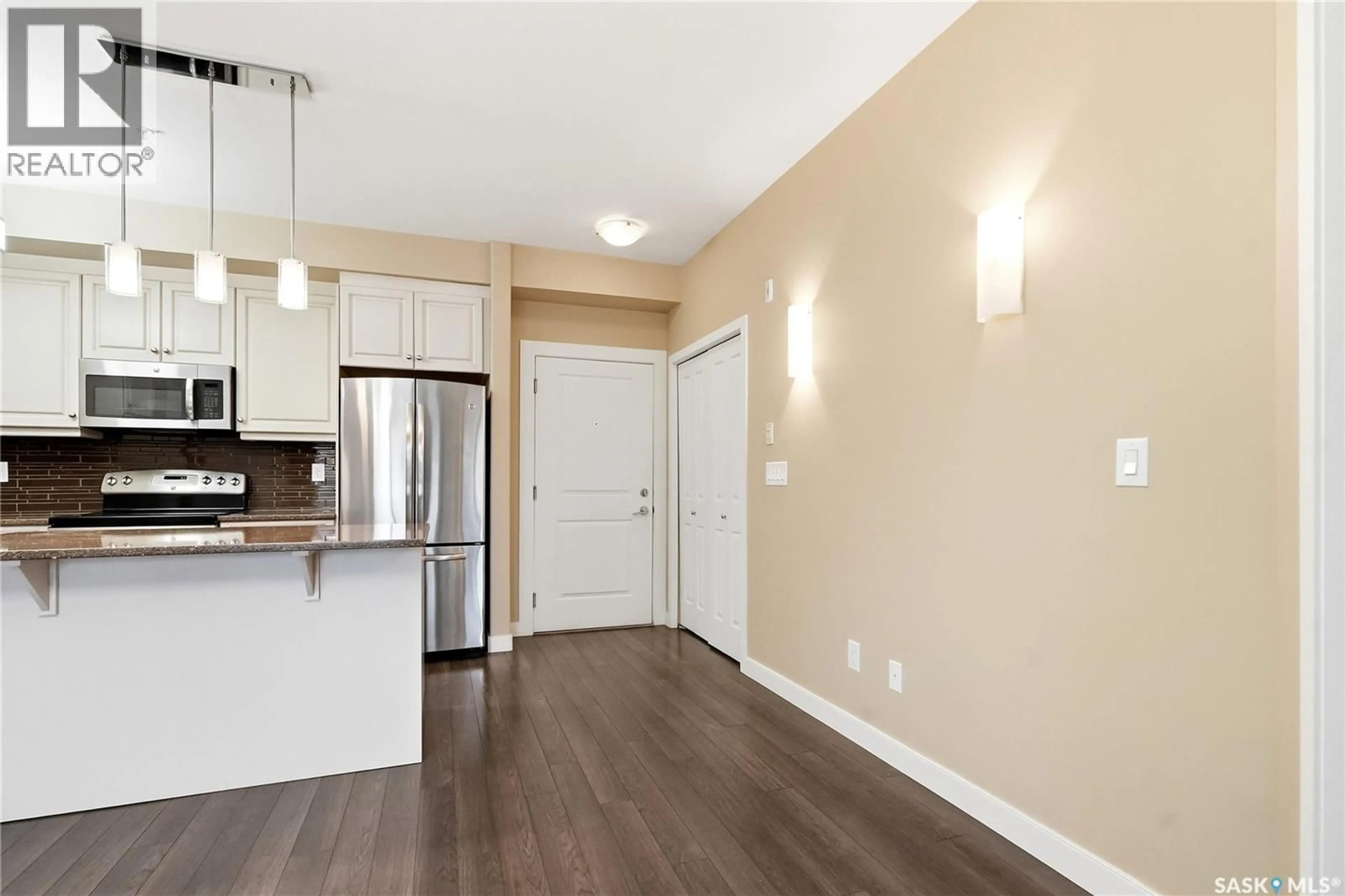 Open concept kitchen, wood/laminate floor for 110 1035 MOSS AVENUE, Saskatoon Saskatchewan S7H2E5