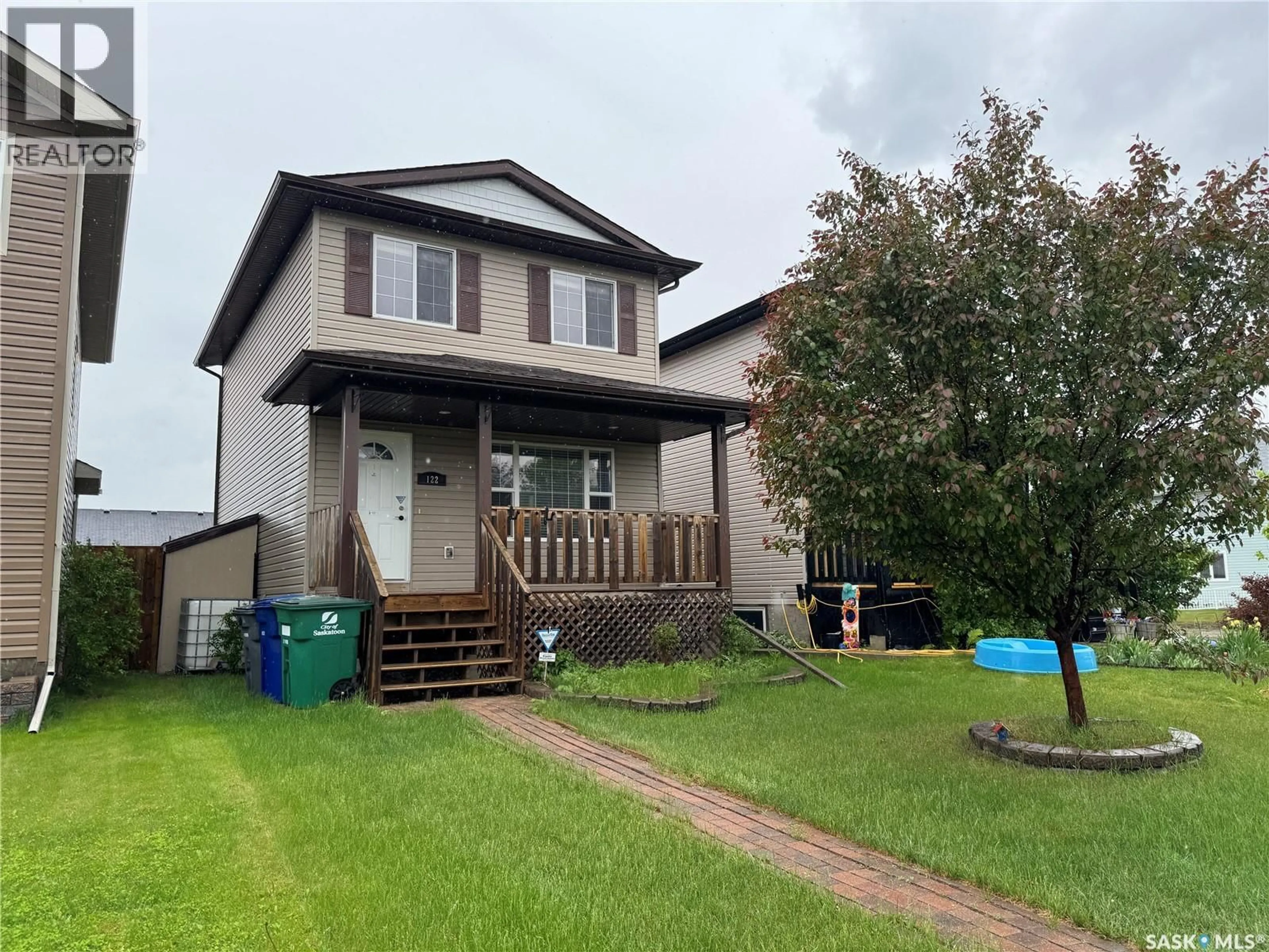 Home with vinyl exterior material, unknown for 122 KEEDWELL STREET, Saskatoon Saskatchewan S7W1B4