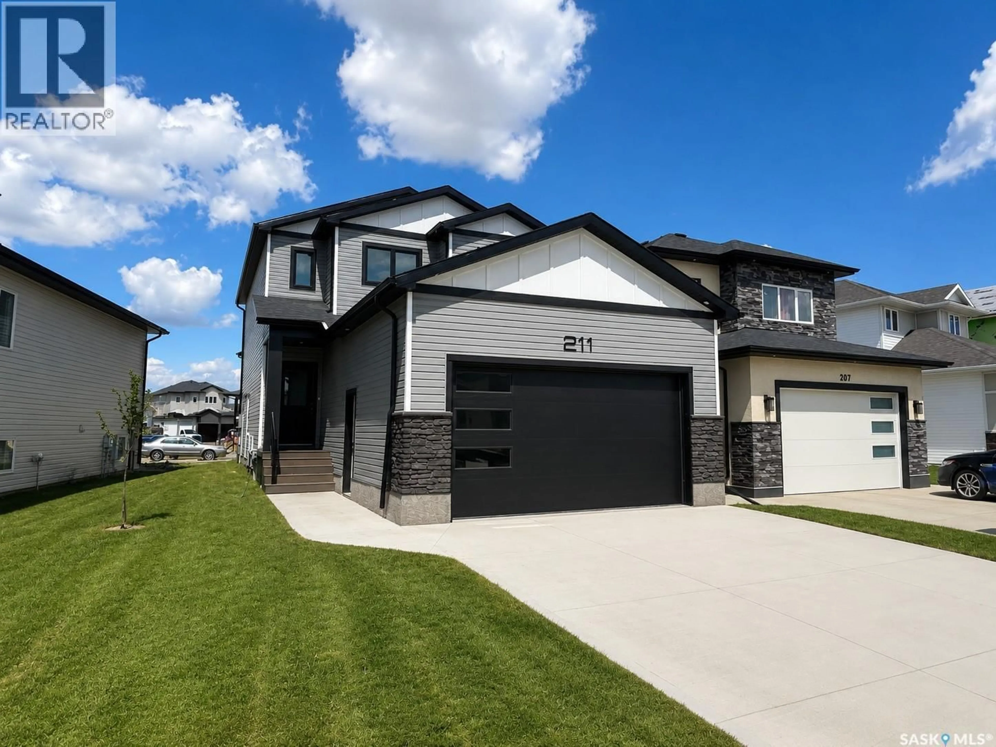 Home with brick exterior material, street for 211 SHARMA LANE, Saskatoon Saskatchewan S7W1K7