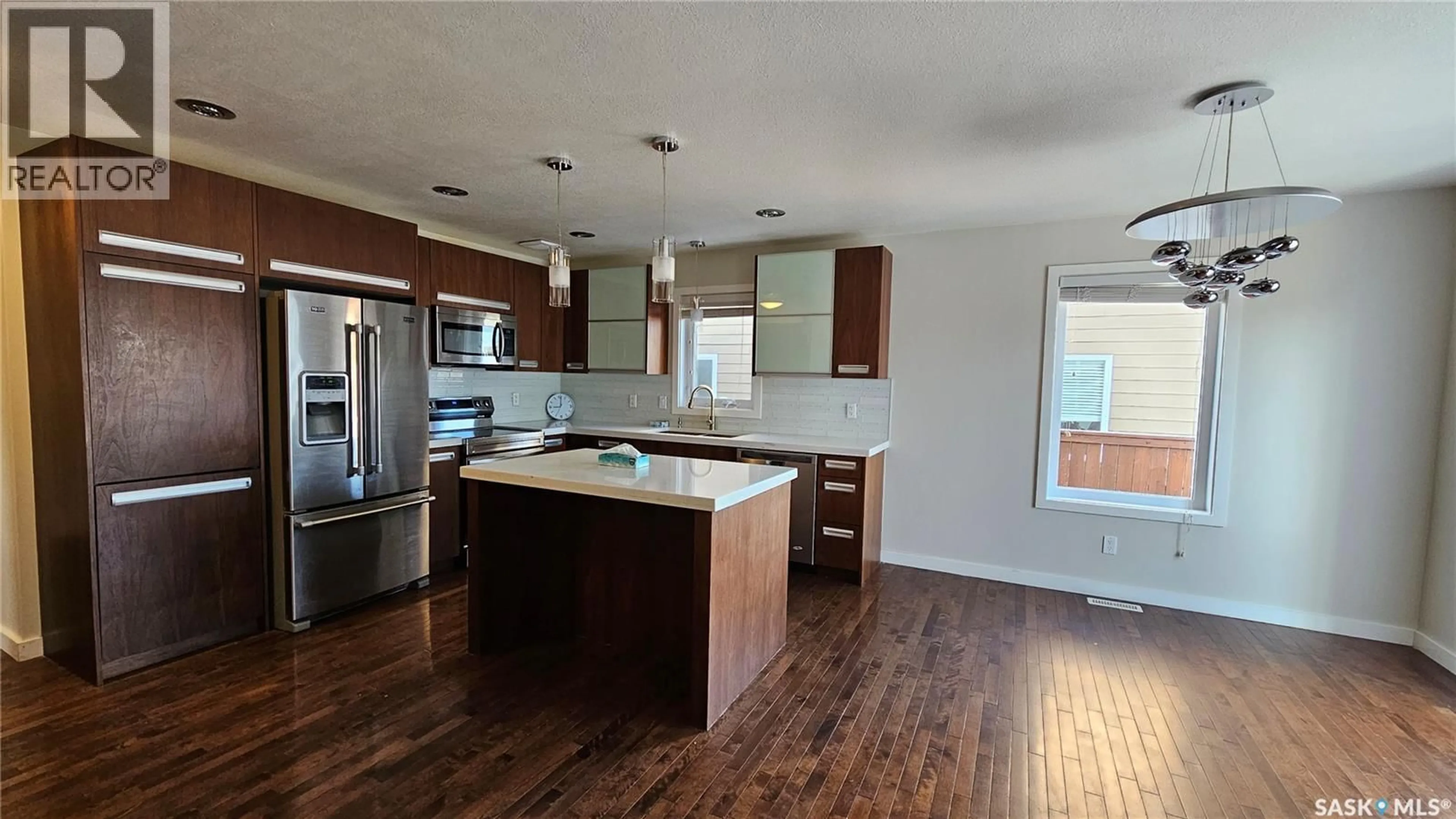 Open concept kitchen, wood/laminate floor for 435 PICHLER CRESCENT, Saskatoon Saskatchewan S7V0H2