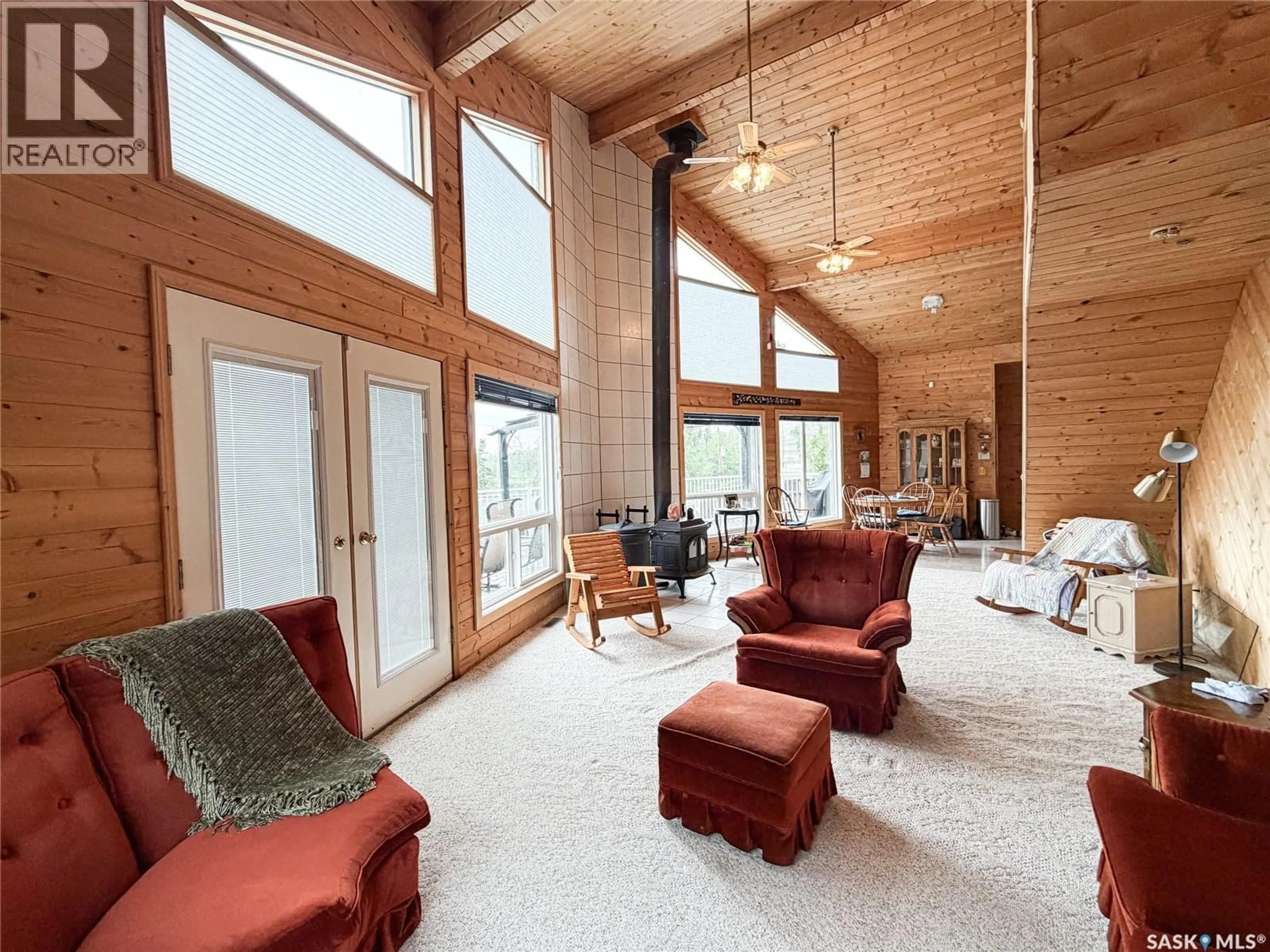 Living room with furniture, wood/laminate floor for 114 2ND AVENUE, Loon Lake Saskatchewan S0M0C1