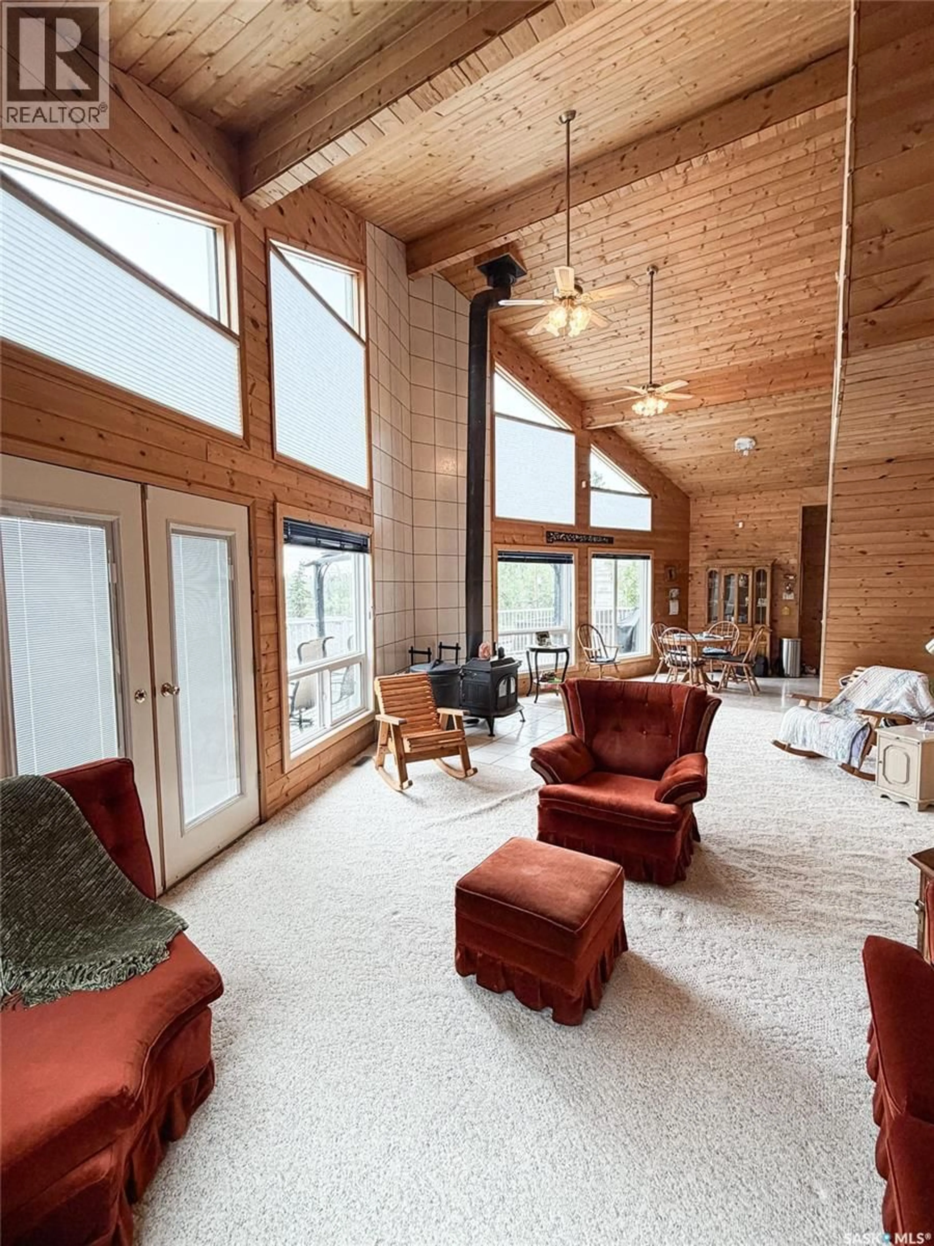 Living room with furniture, wood/laminate floor for 114 2ND AVENUE, Loon Lake Saskatchewan S0M0C1