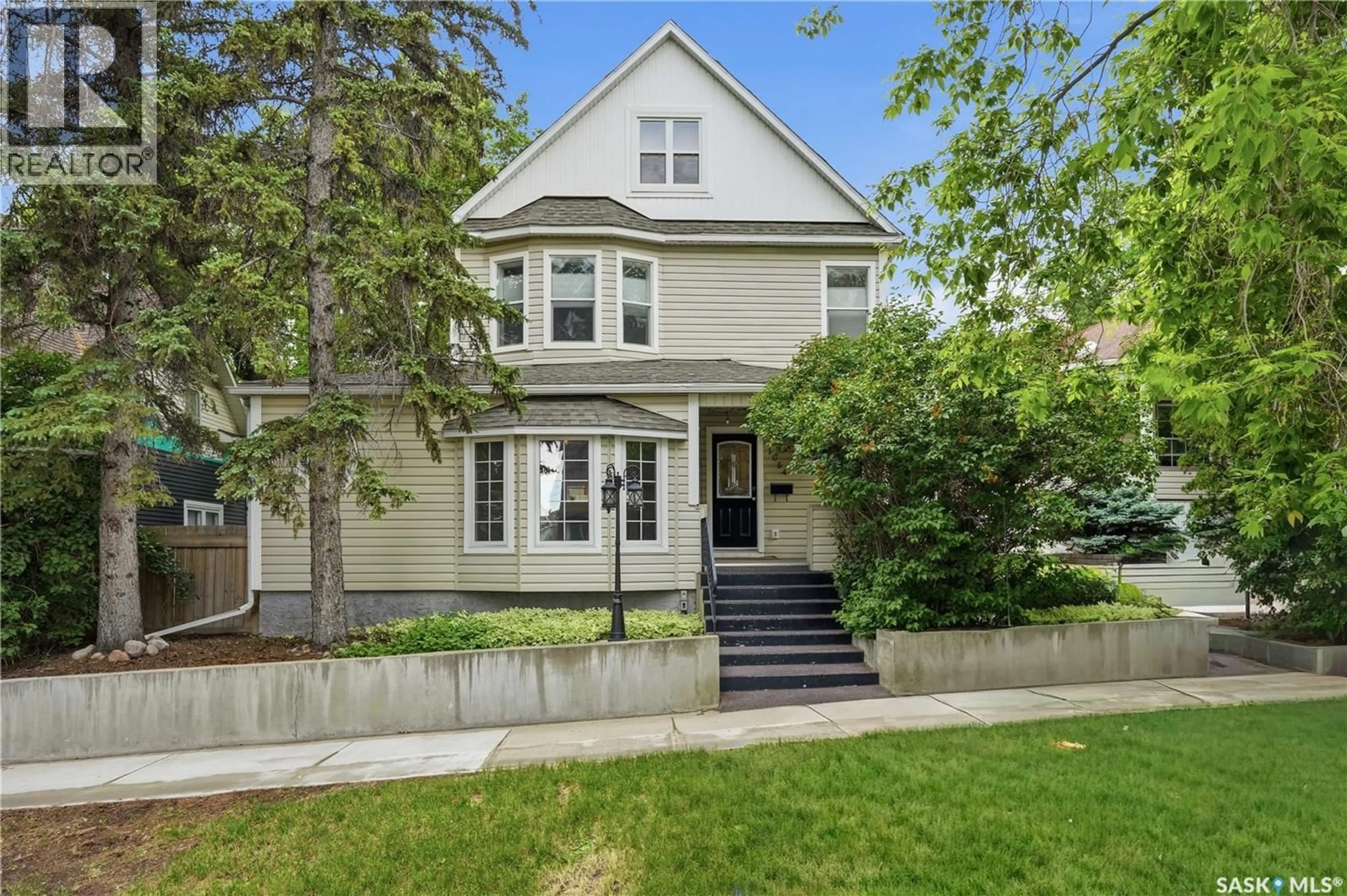 Home with vinyl exterior material, street for 1054 CLIFTON AVENUE, Moose Jaw Saskatchewan S6H3L2