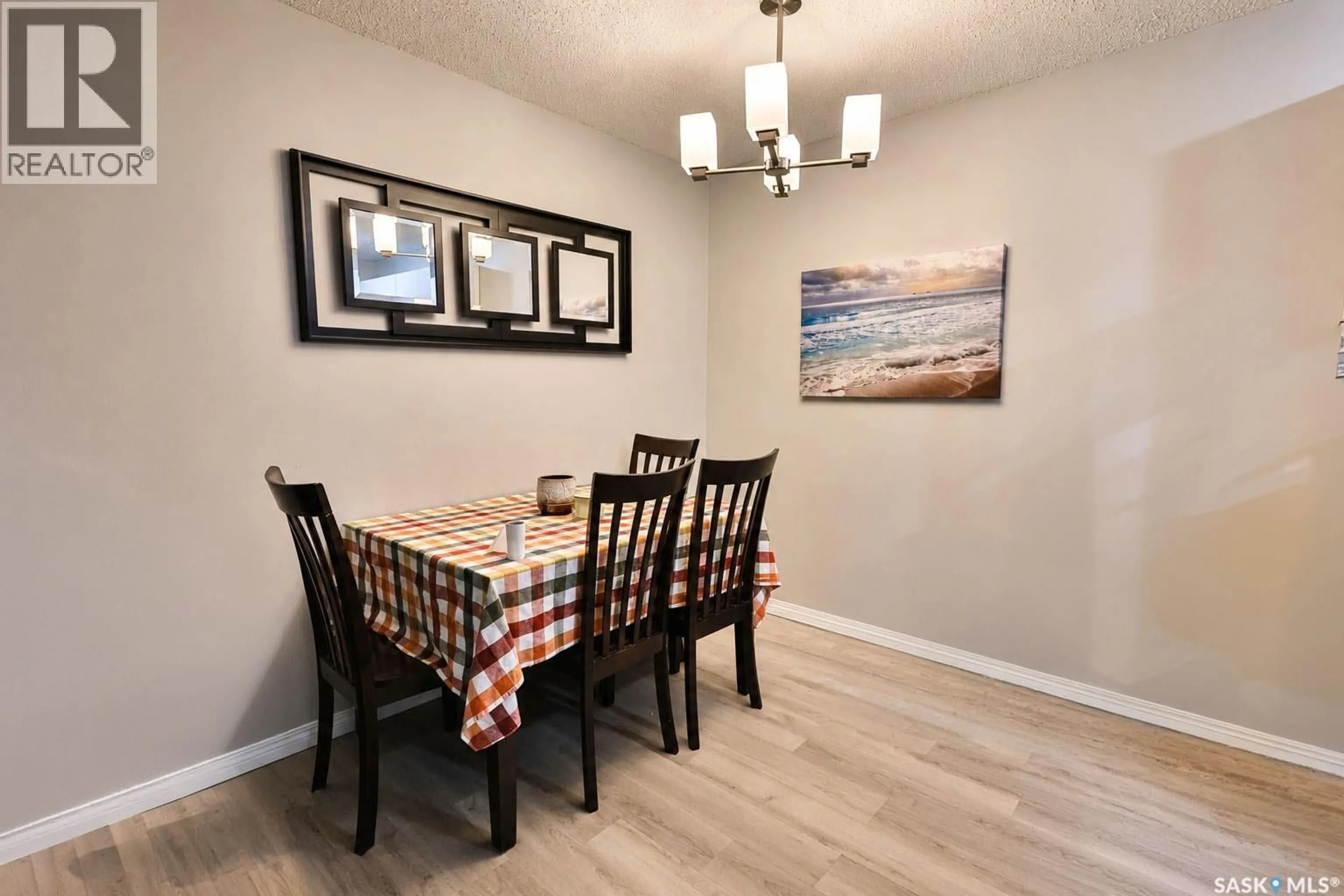 Dining room, wood/laminate floor for 1580 - 514 OLIVE DIEFENBAKER DRIVE, Prince Albert Saskatchewan S6V7M6