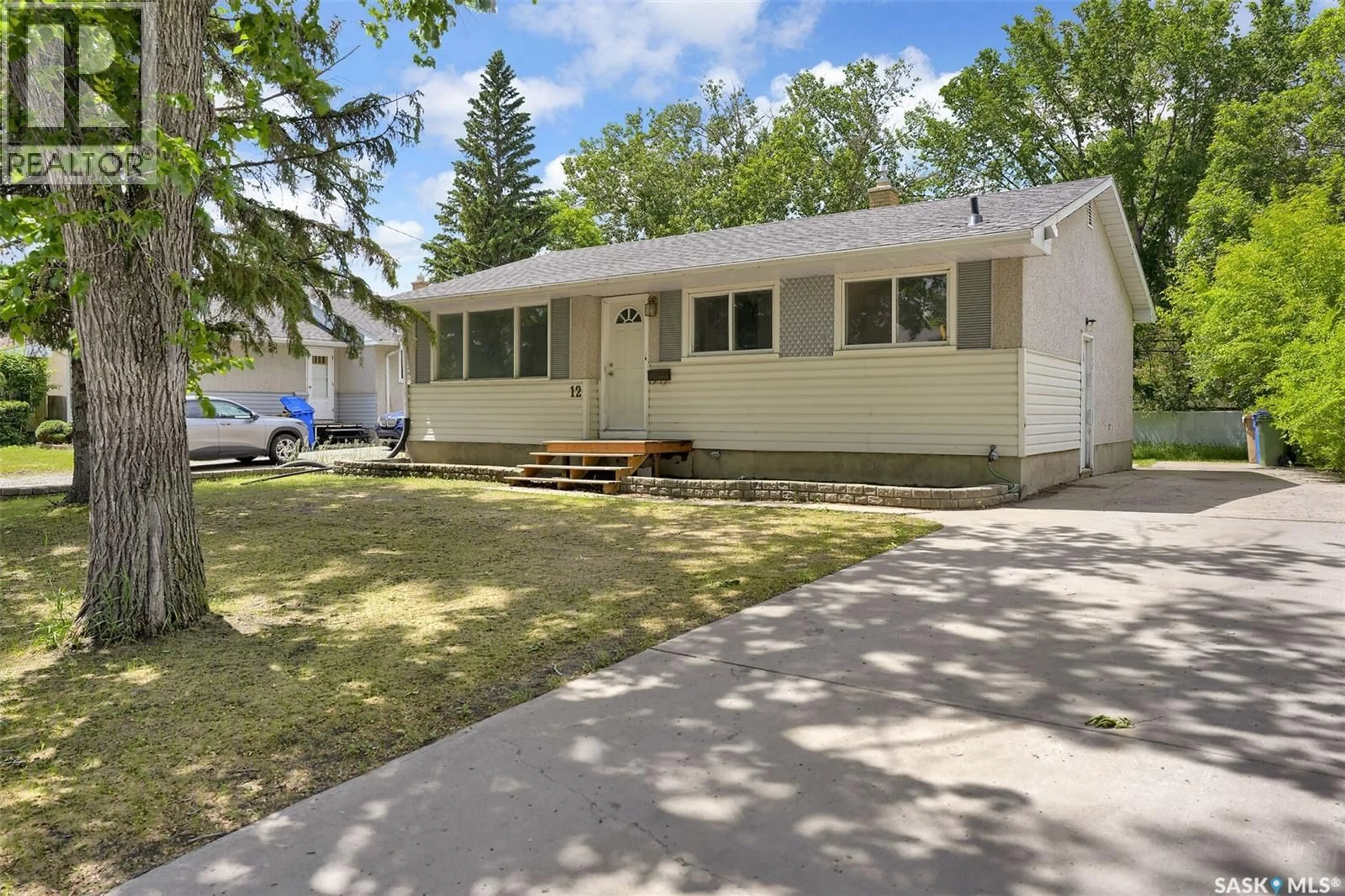 Home with vinyl exterior material, street for 12 BIRCHWOOD ROAD, Regina Saskatchewan S4S5N2